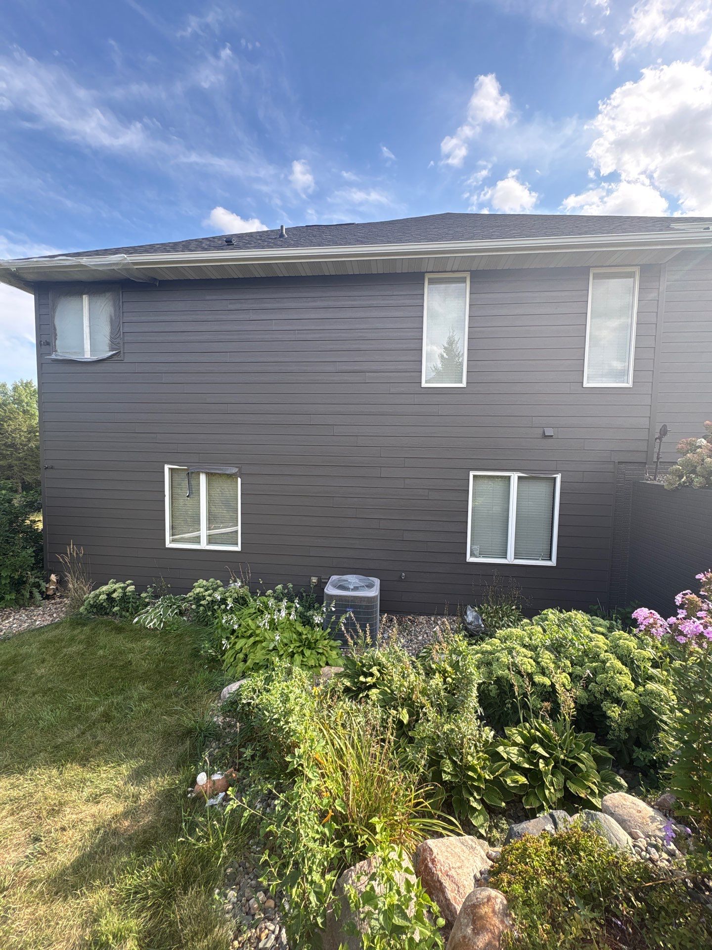 Sioux Falls Residential Exterior Painting and Siding Refresh by Select Painting, Coatings & Garage Cabinets