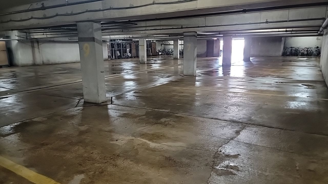 Parking garage using Hot water by Northern Power Washing LLC.