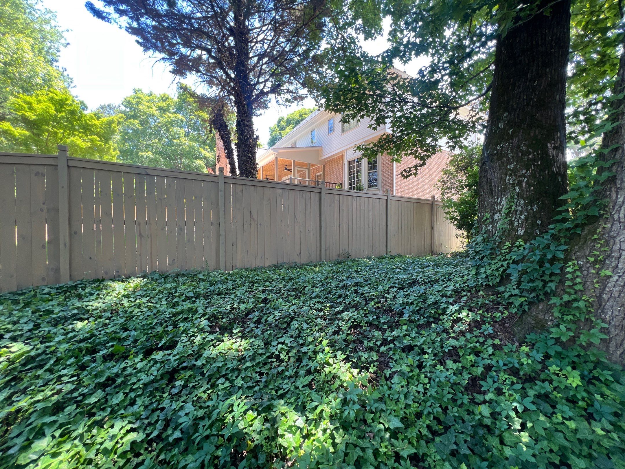 Pressure-Treated Wood Fence Installation and Deck Staining in Atlanta by Swift Home Renovations