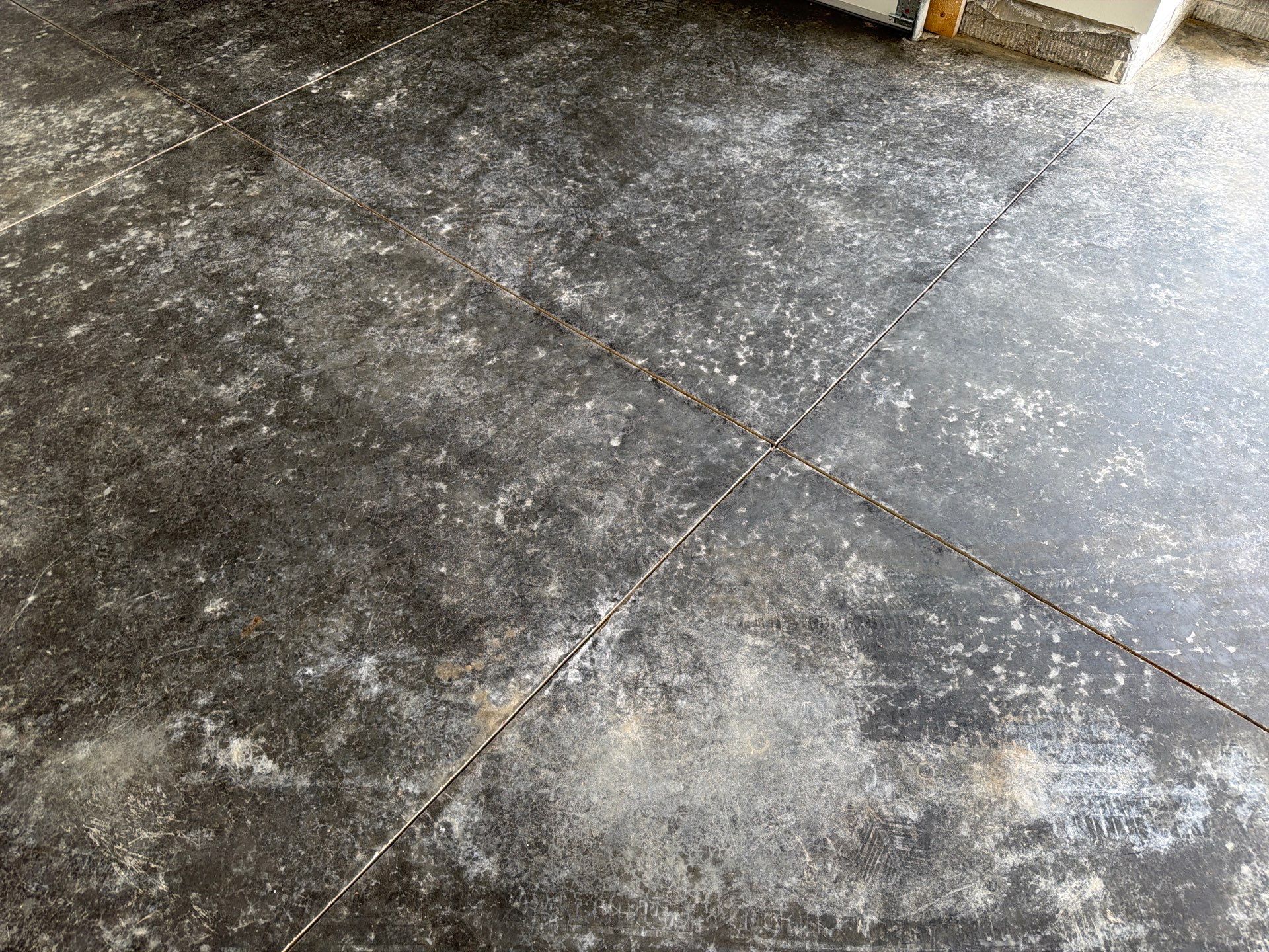 Cabin Fever Decorative Flake Garage Floor Coating in Sioux Falls by Select Painting, Coatings & Garage Cabinets
