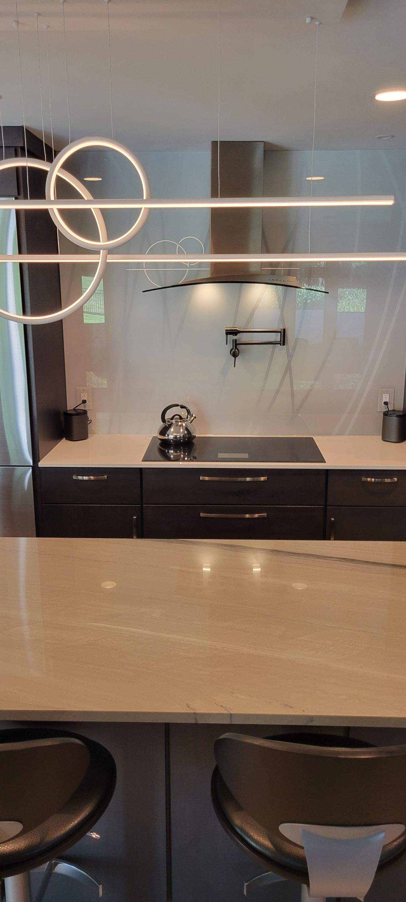 Kitchen Remodel using IMAGIO Misty Curves Solid Glass Backsplash by IMAGIO