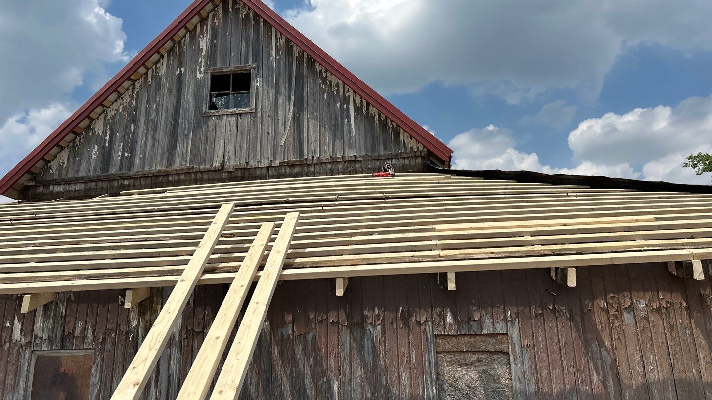 Residential Roofing Installation using Standing Seam Metal - Barn Red by RoofX 