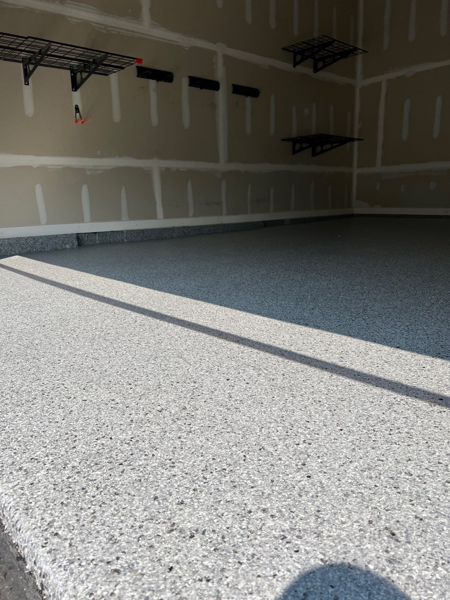 Silverado garage floor coating  by NG Masonry & Construction LLC