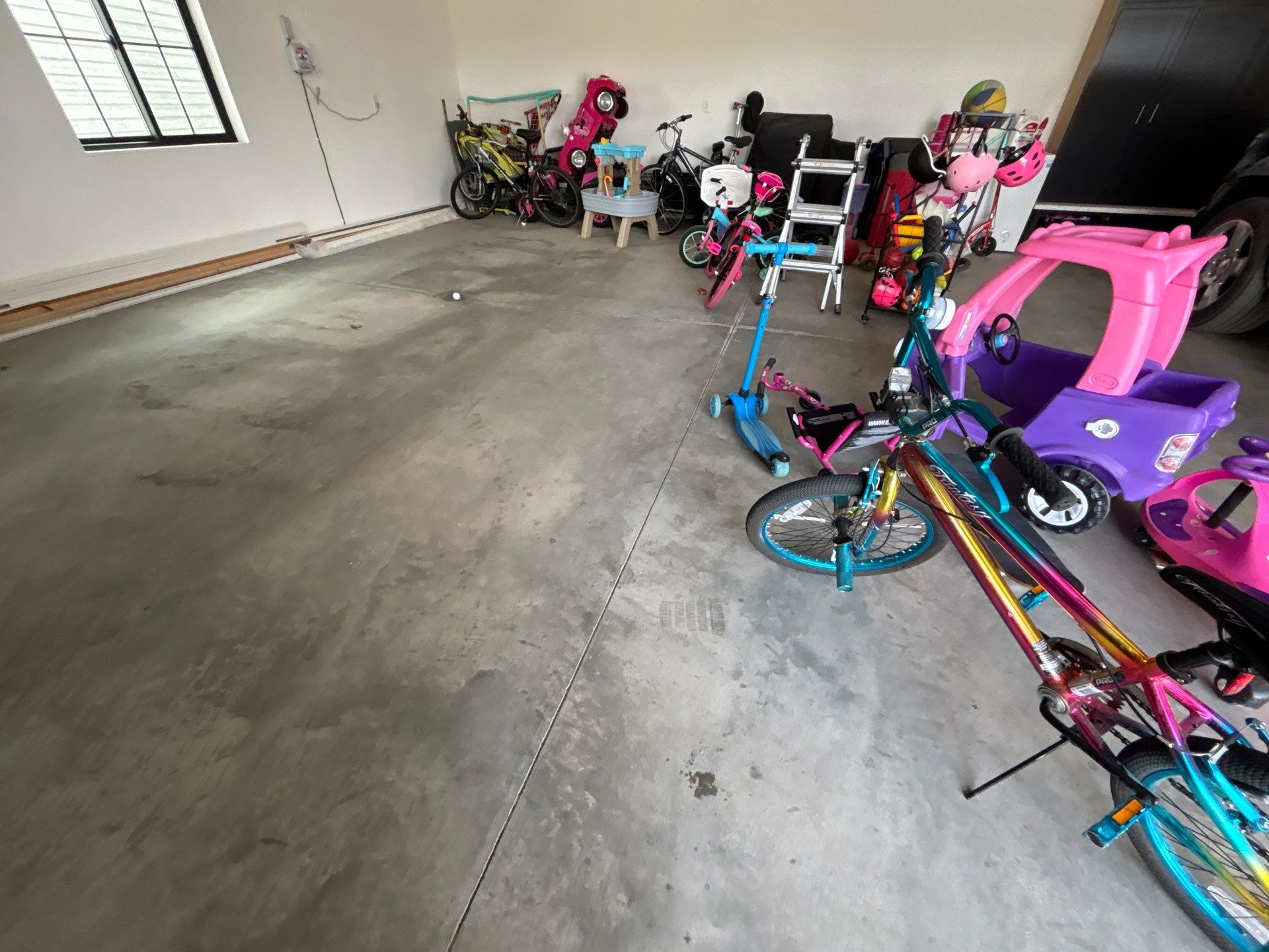 Custom Speckled Concrete Coating for Dell Rapids Garage by Select Painting, Coatings & Garage Cabinets