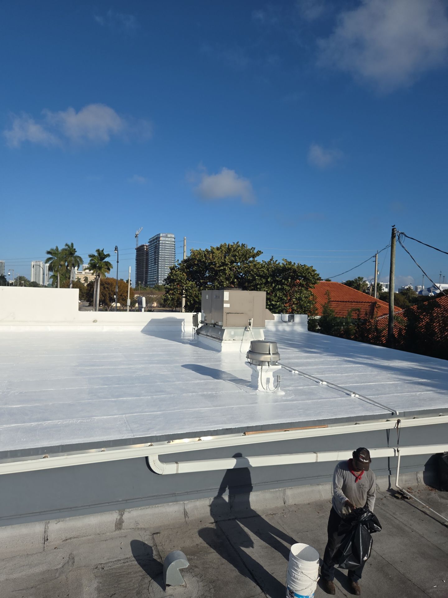 Commercial Flat Roof Restoration Using Silicone Coating in Hallandale Beach by Aastro Roofing