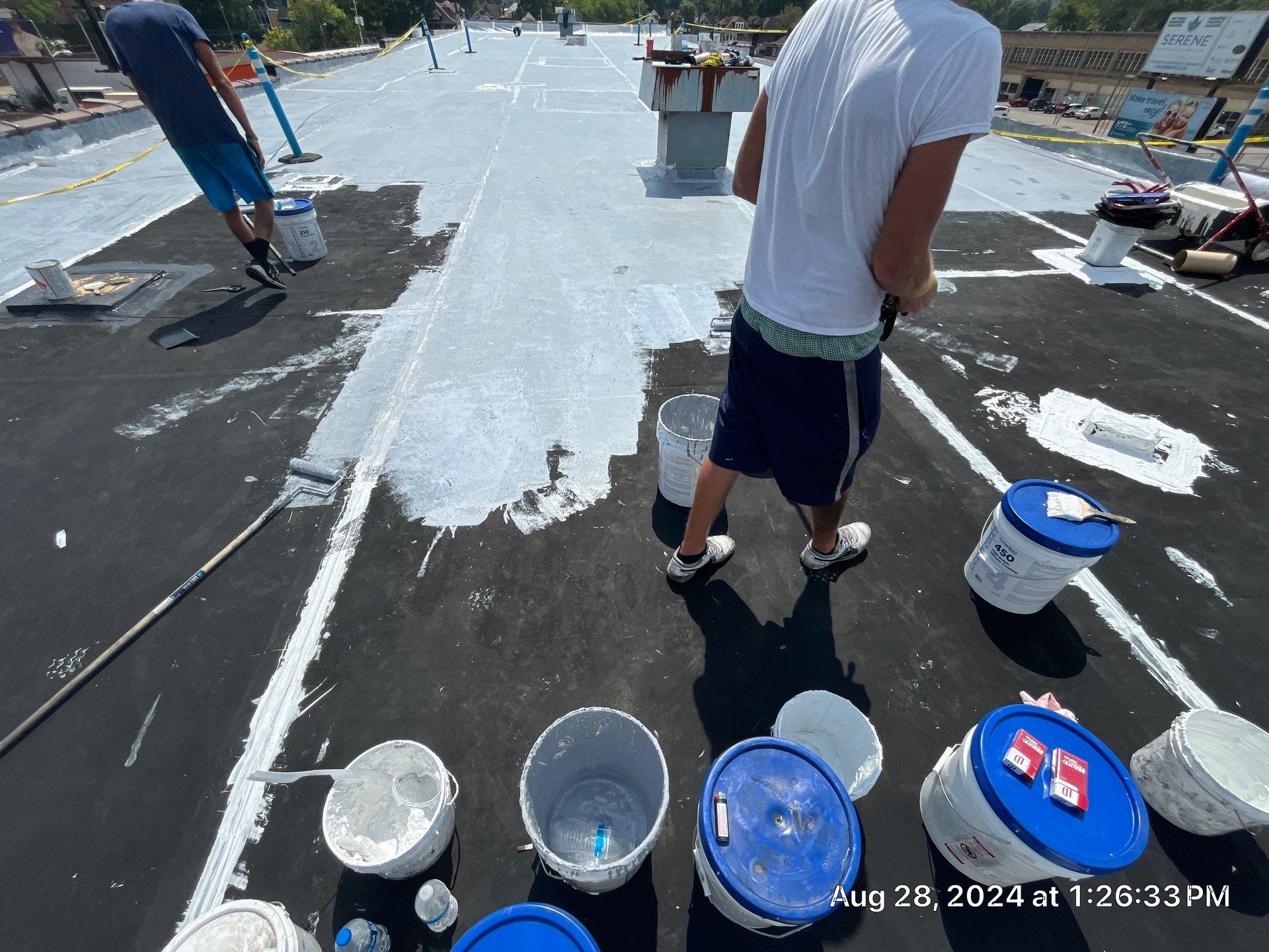 Commercial Roofing Installation using smartcoat Roof coating by Fahey Roofing + Contracting