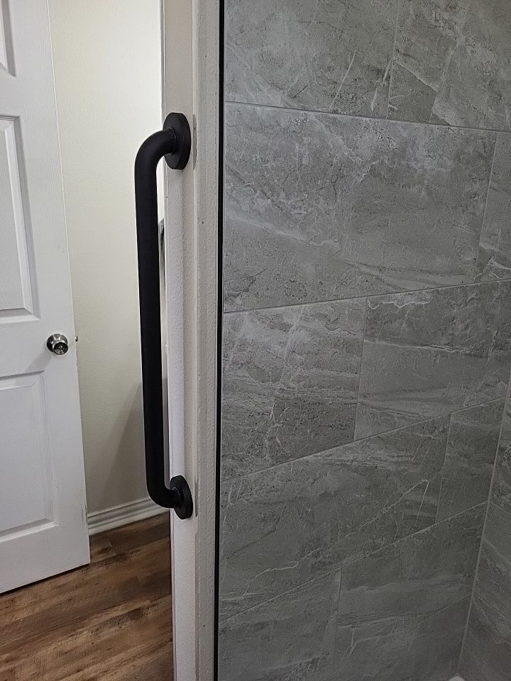 Bathroom Remodel using Tile  by SLM General Contractors & Roofing