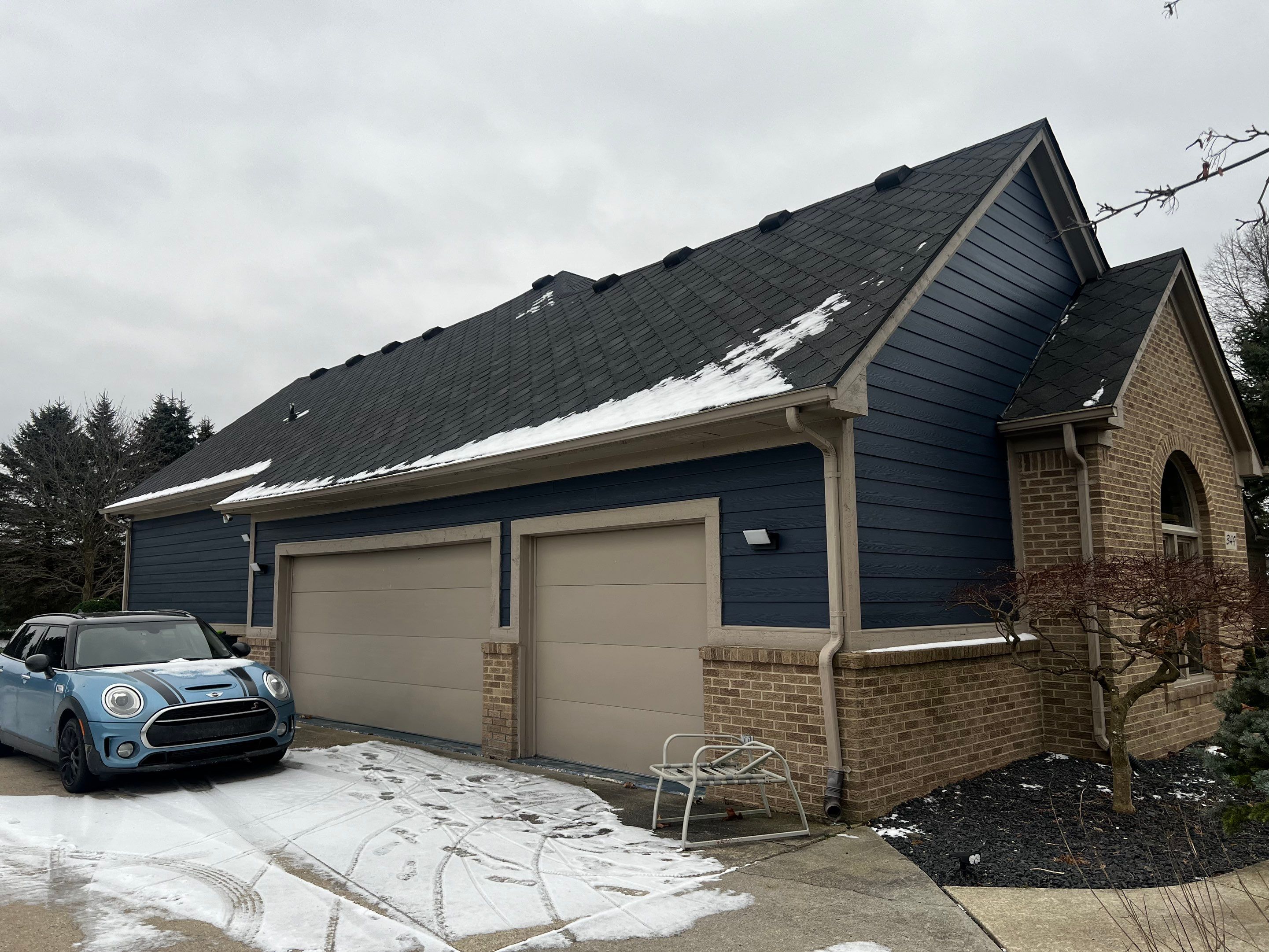 Siding Replacement using James HardiePlank Cedarmill in Deep Ocean color by Bloomfield Construction & Restoration