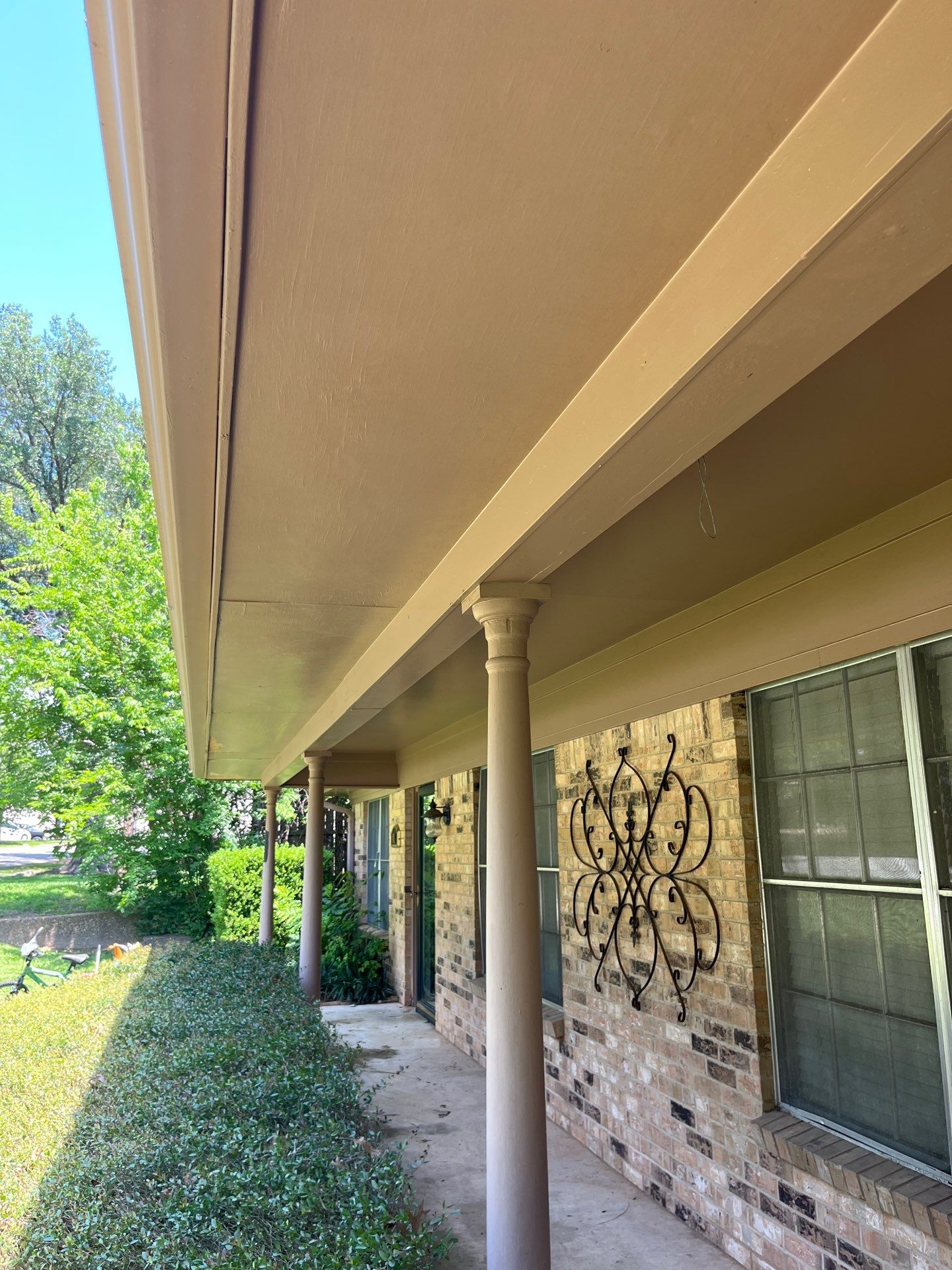 Exterior Painting in Tyler, TX | Eaves, Door & Columns in Elegant Black by Quality Coats Painting