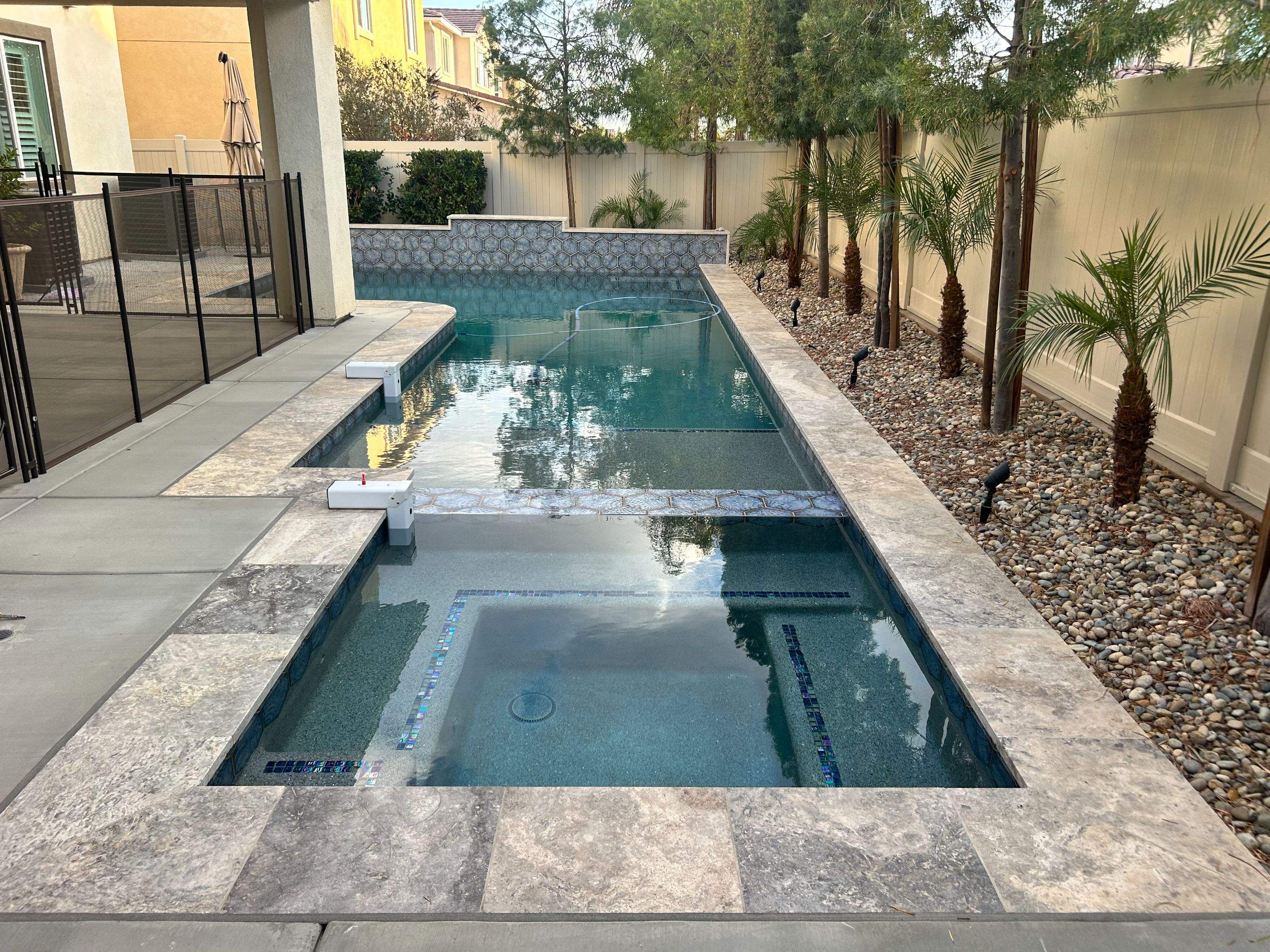 Pool and spa in a tight yard by Premier Pools and Spas Temecula