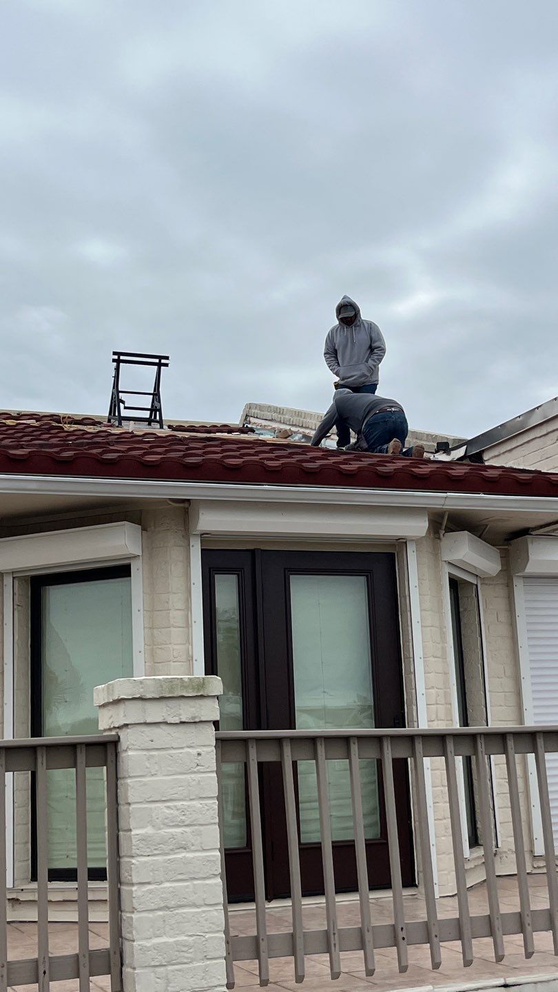 Off with the Tile and on with the TILCOR stone coated metal.  by Bayfront Roofing and Construction