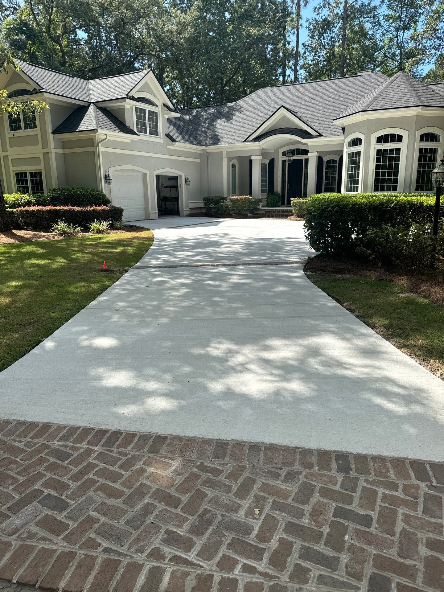 Hilton Head Island Concrete Driveway Replacement with Herringbone Brick Inlays by Lowcountry Scapes, LLC