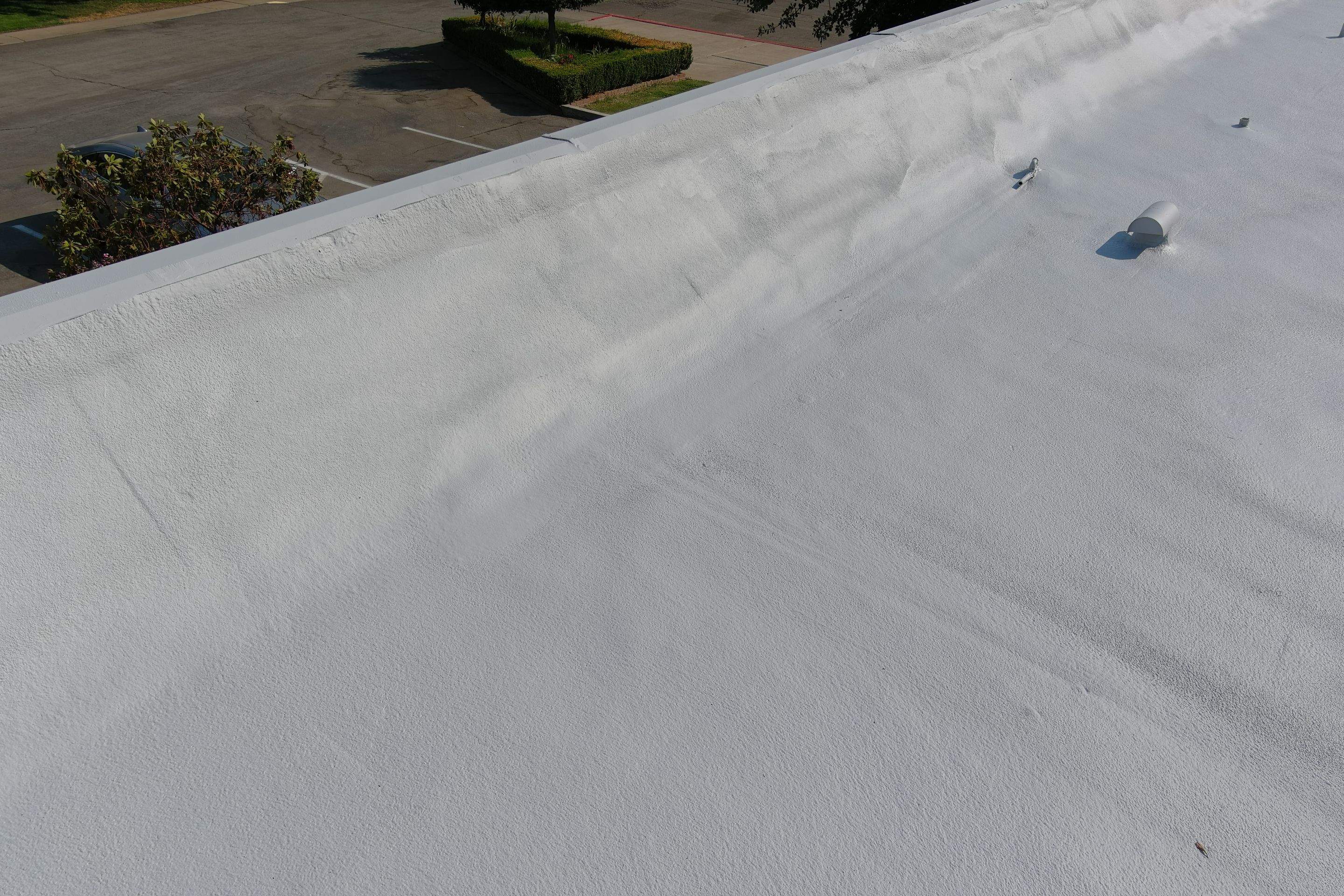 Commercial Roofing Installation using General Coatings acrylic coatings and spray foam by Straight Edge Roofing Inc