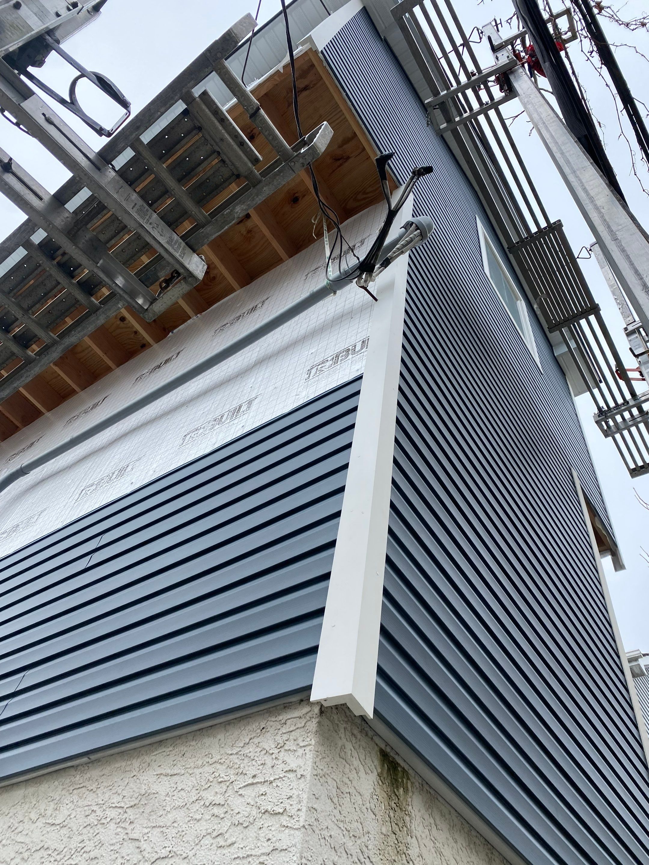 House lift in the westend of Long Beach. by Above All Gutters