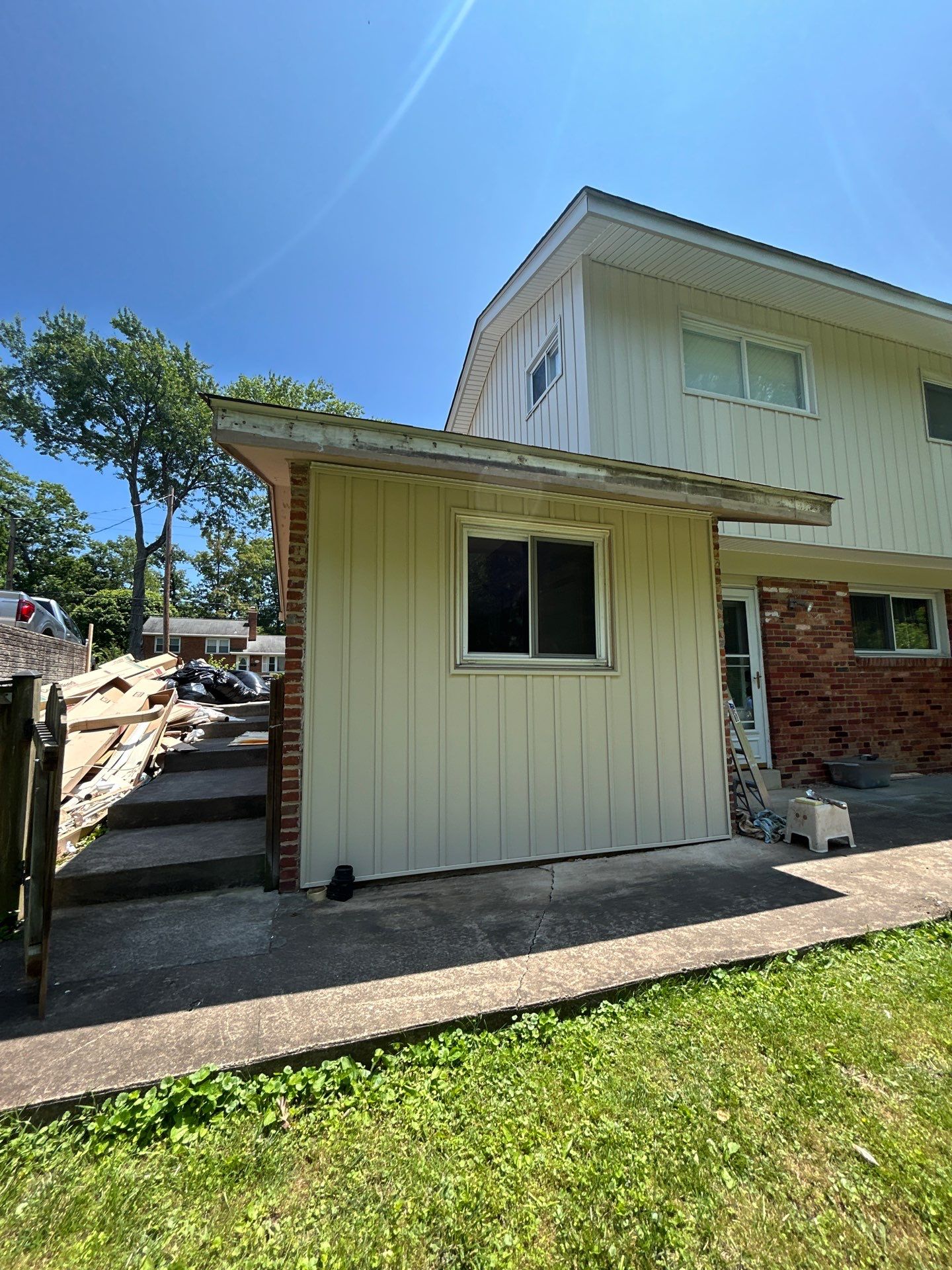 Fairfax: Residential Siding Replacement with CertainTeed 8" Board and Batten Siding in Desert Tan by RM Banning, Inc.
