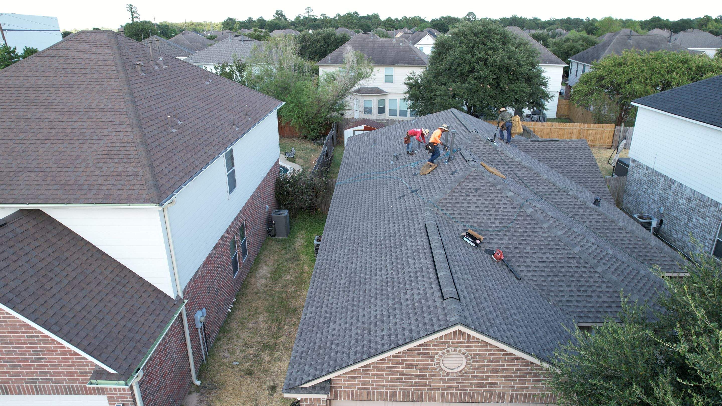 Full Roof Replacement on Two-Story Brick Home — Spring, TX by PL Roofing & SB Roofing, LLC.