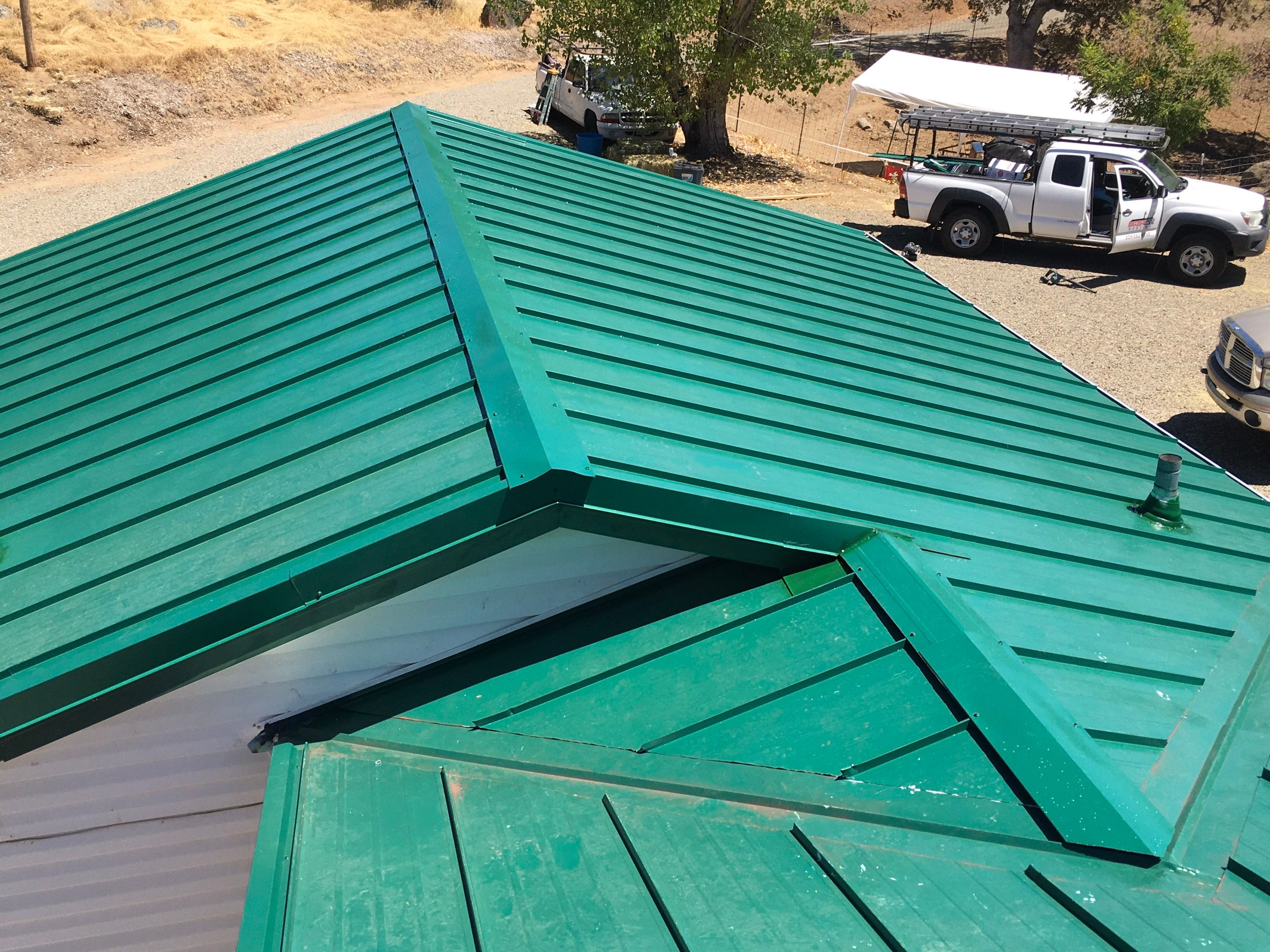 Metal roofing installation using Standing seam metal roofing system by Straight Edge Roofing Inc