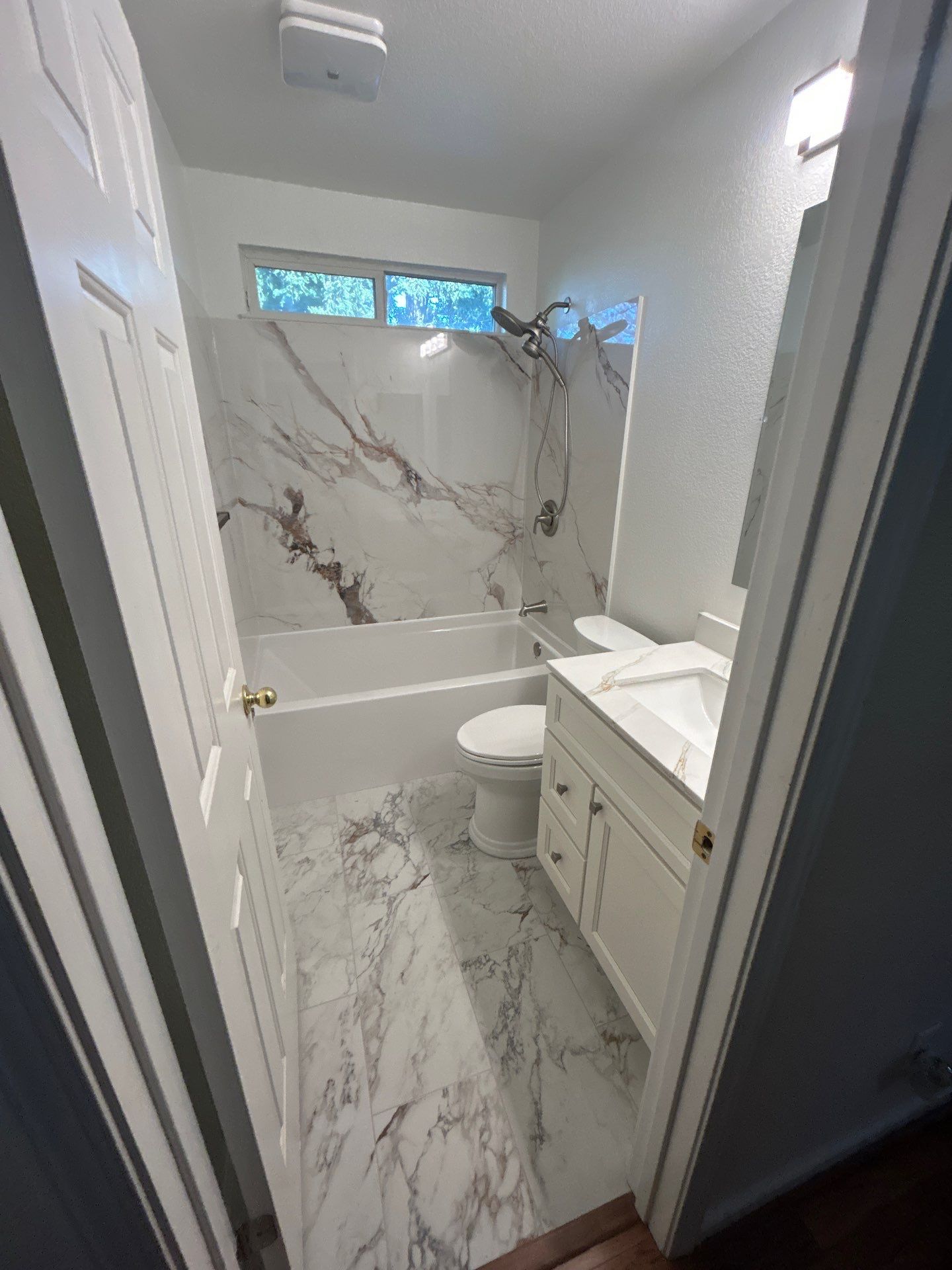 Bathroom Remodel Featuring Marble Stone Panels in Vacaville by H4H Remodeling and Repairs Inc.