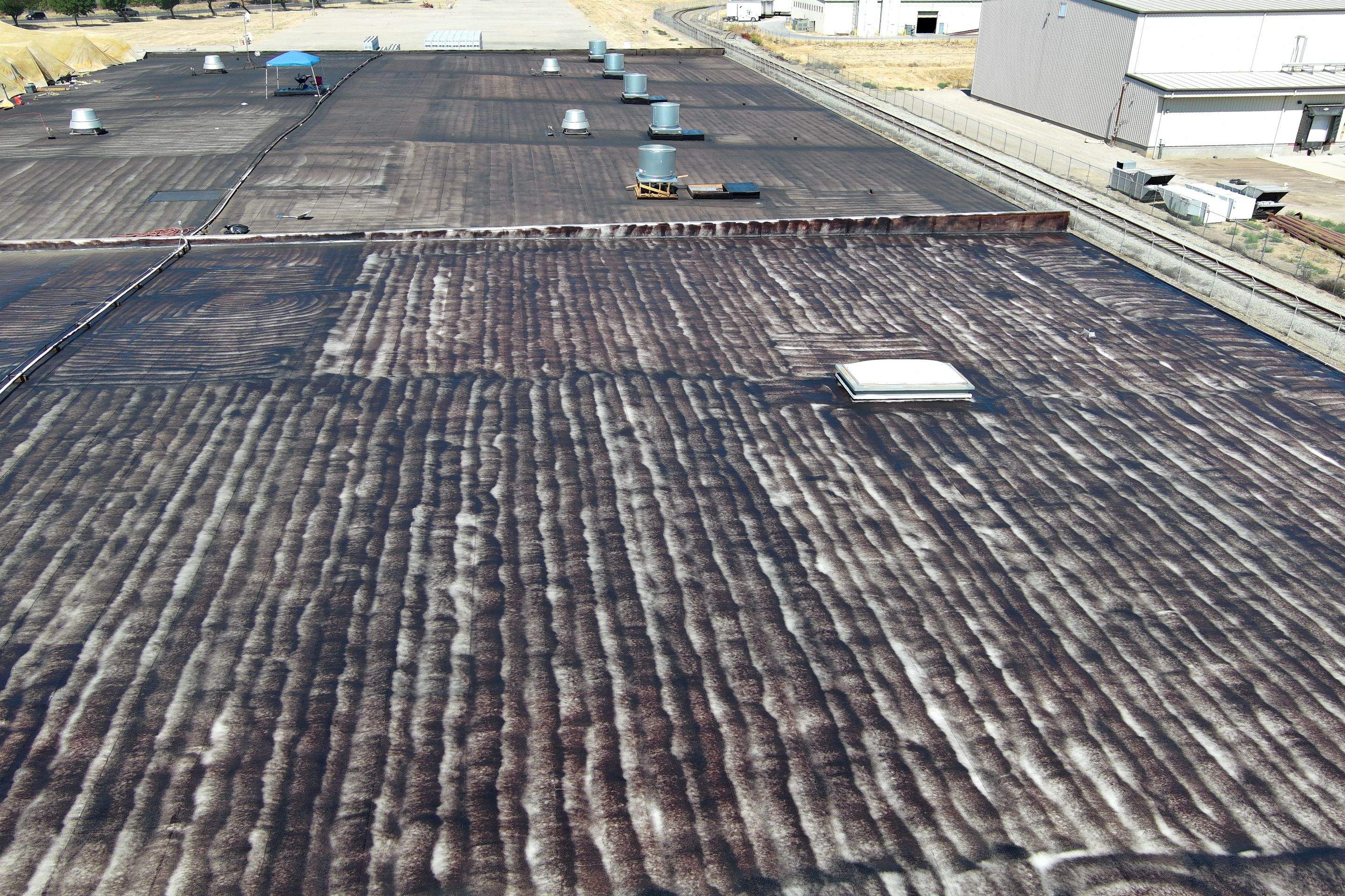 Pro Farms Spray foam roofing project by Straight Edge Roofing Inc