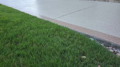 Driveway and sidewalk using Feldspar with the border done in Spilite