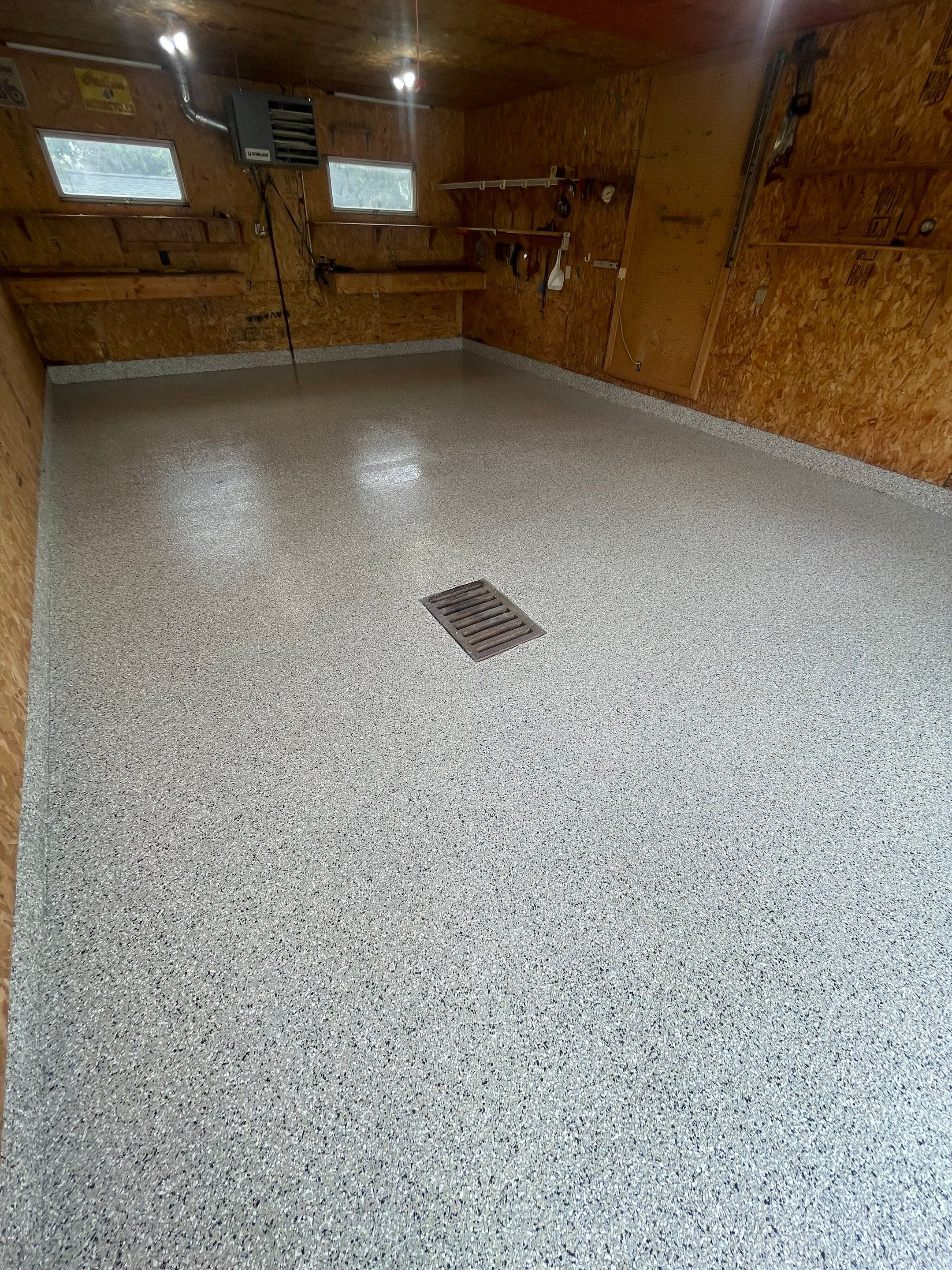 Speckled Epoxy Flake Concrete Coating for Worthington Garage Floor by Select Painting, Coatings & Garage Cabinets