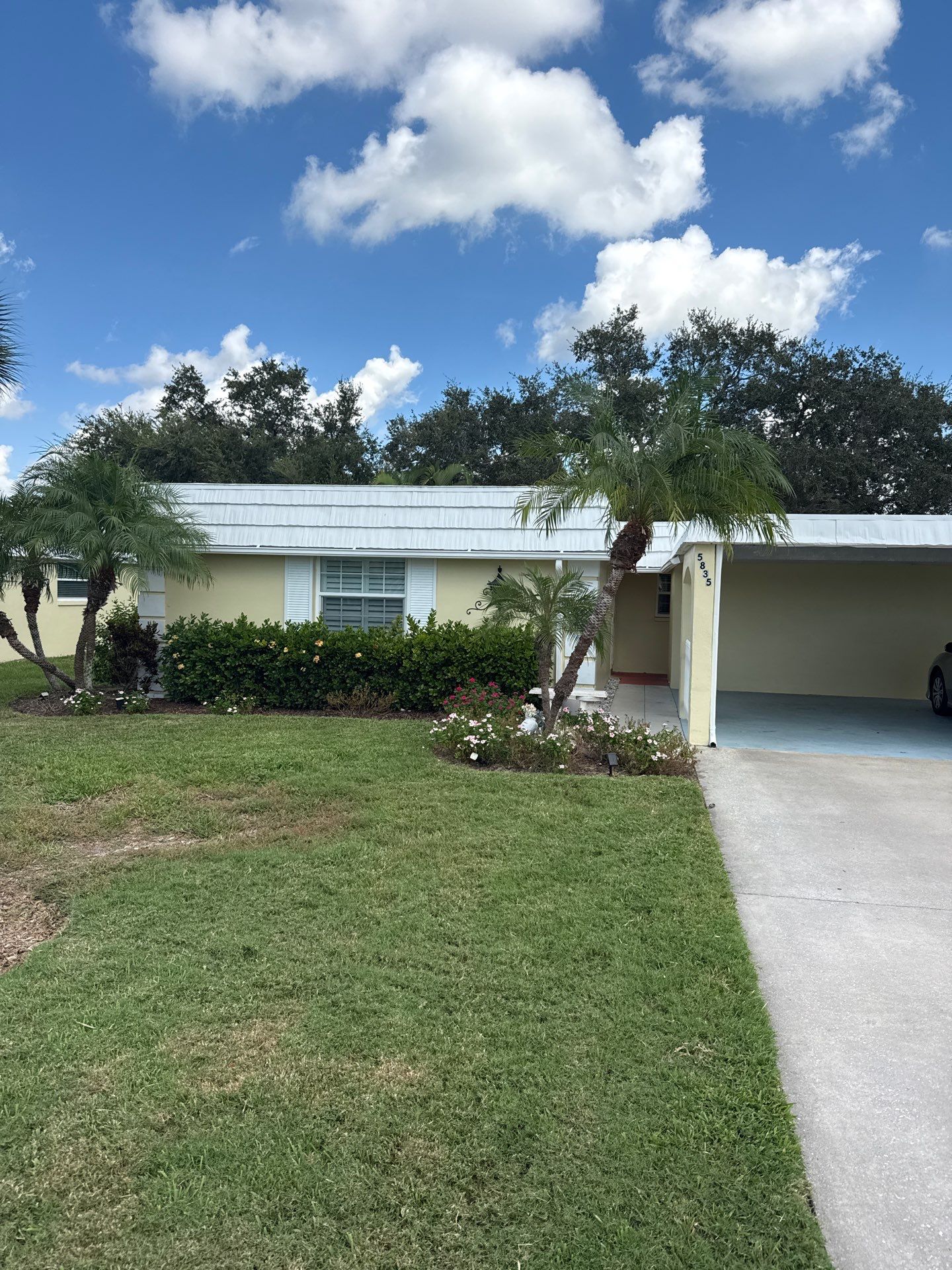 White Gutters and Matching Downspouts in Sarasota FL by Gutter Professors
