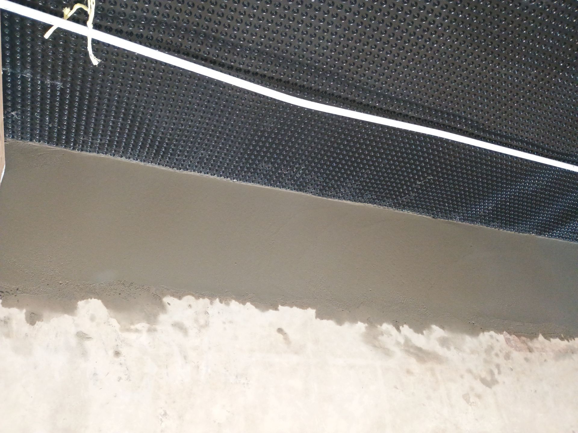 Interior Drain Tile & Foundation Crack Repair in St. Anthony, MN by Waterproofing Northeast