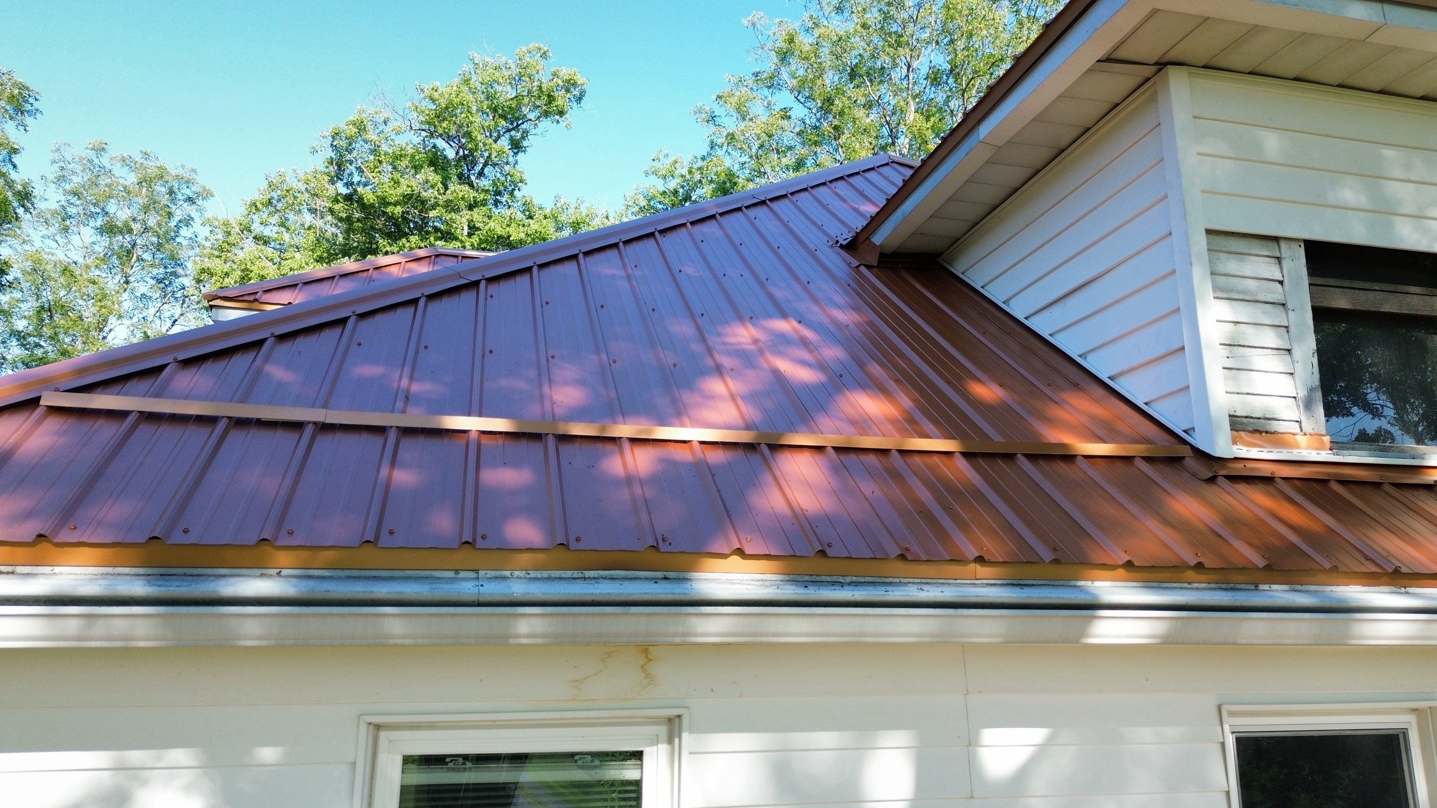 Residential Roofing Installation using Performance Panel Metal - Copper Metallic by RoofX 