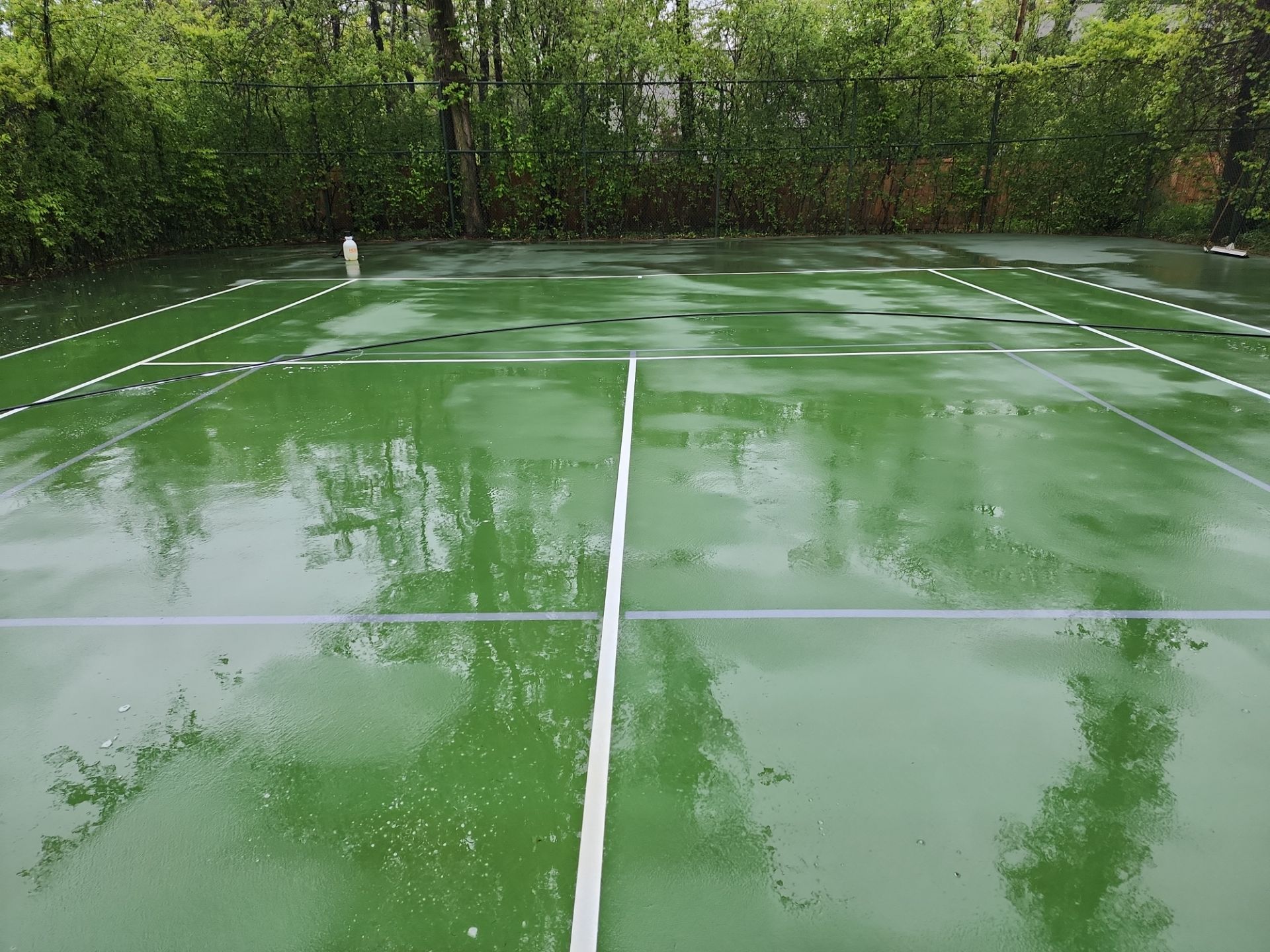 Tennis Court using Algaecide, soft wash soap by Northern Power Washing LLC.