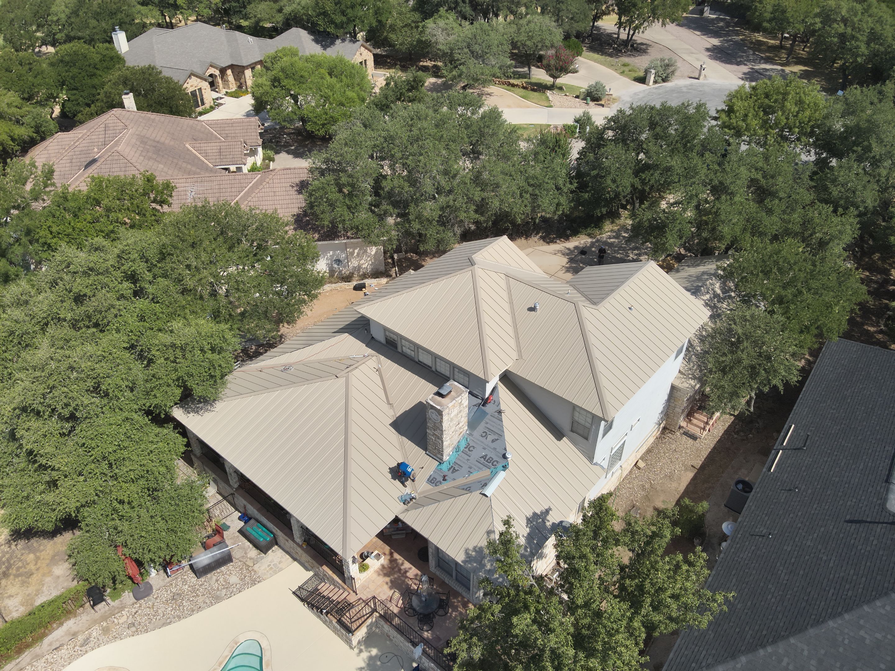 Residential Roof Replacement using 24 GA Double-Lock - Surrey Beige by Action Exteriors Austin