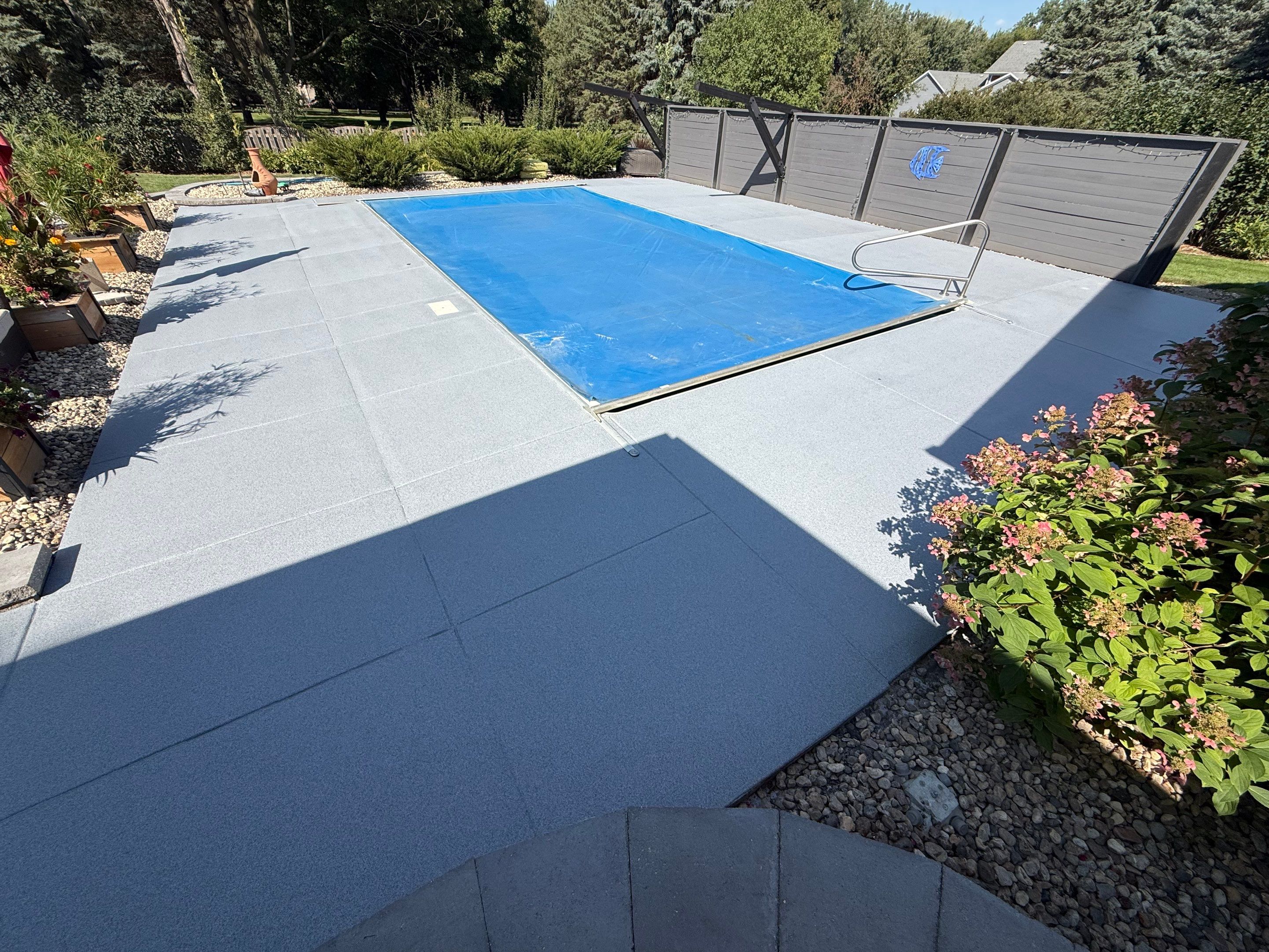 Garage Floor and Textured Pool Deck Coating in Sioux Falls by Select Painting, Coatings & Garage Cabinets
