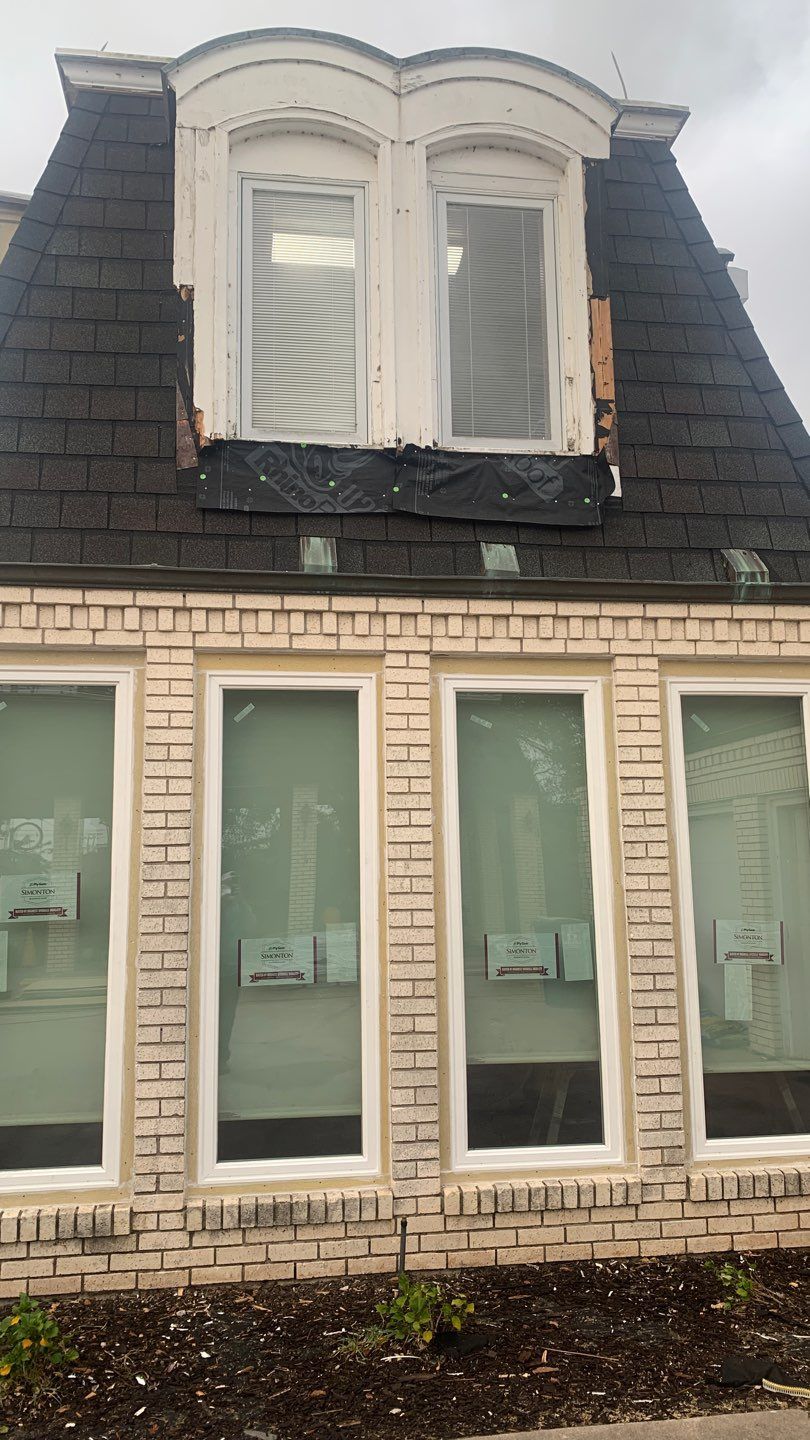 Mansard Charm by Bayfront Roofing and Construction
