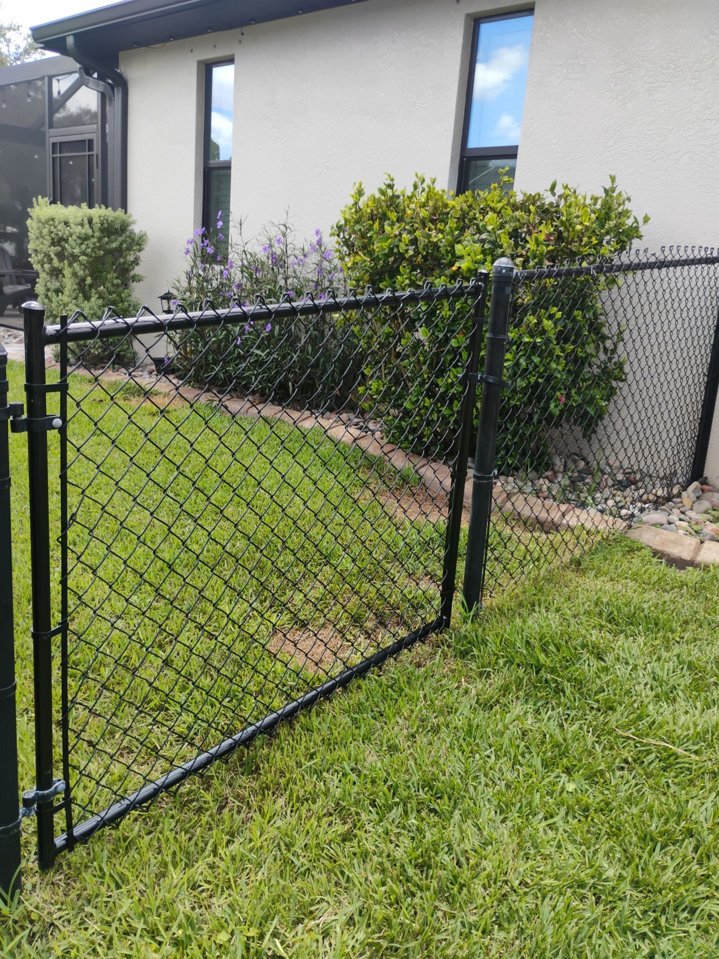Black Vinyl-Coated Chain Link Gate Repair in North Port by True Fence LLC