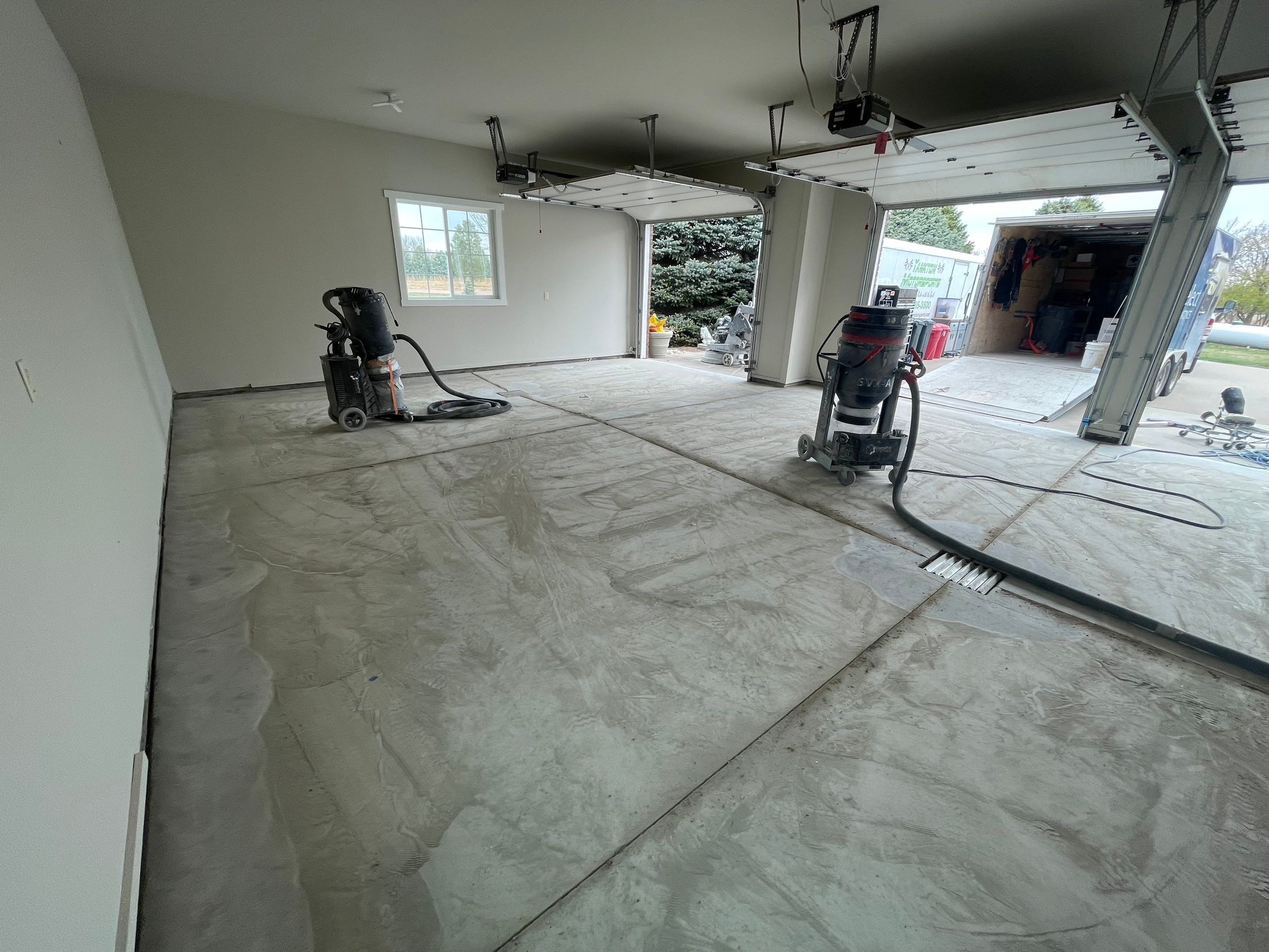 Garage transformation in Yankton by Select Painting, Coatings & Garage Cabinets