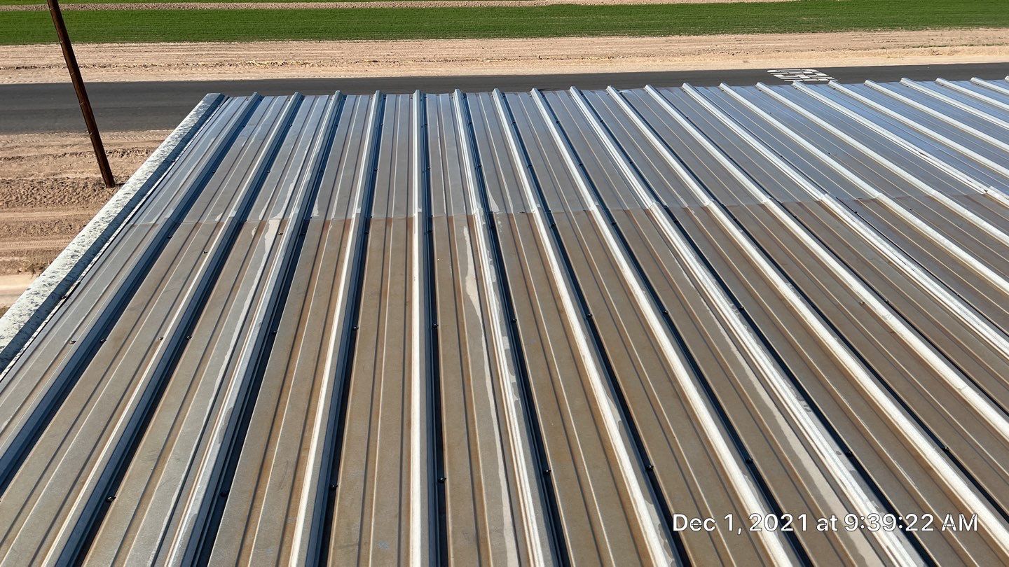 Metal roof restoration on commercial roof using Conklin Benchmark/PUMA XL fabric and coating by Straight Edge Roofing Inc