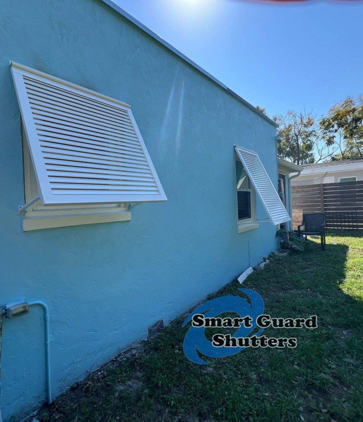 Decorative Bahama Shutters in Signal White  by Smart Guard Shutters