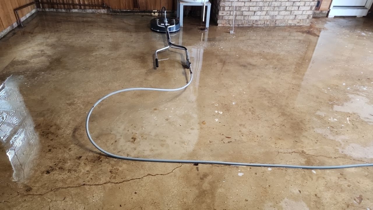 garage floor clean using cleaner by G&H Home Tech Pros LLC