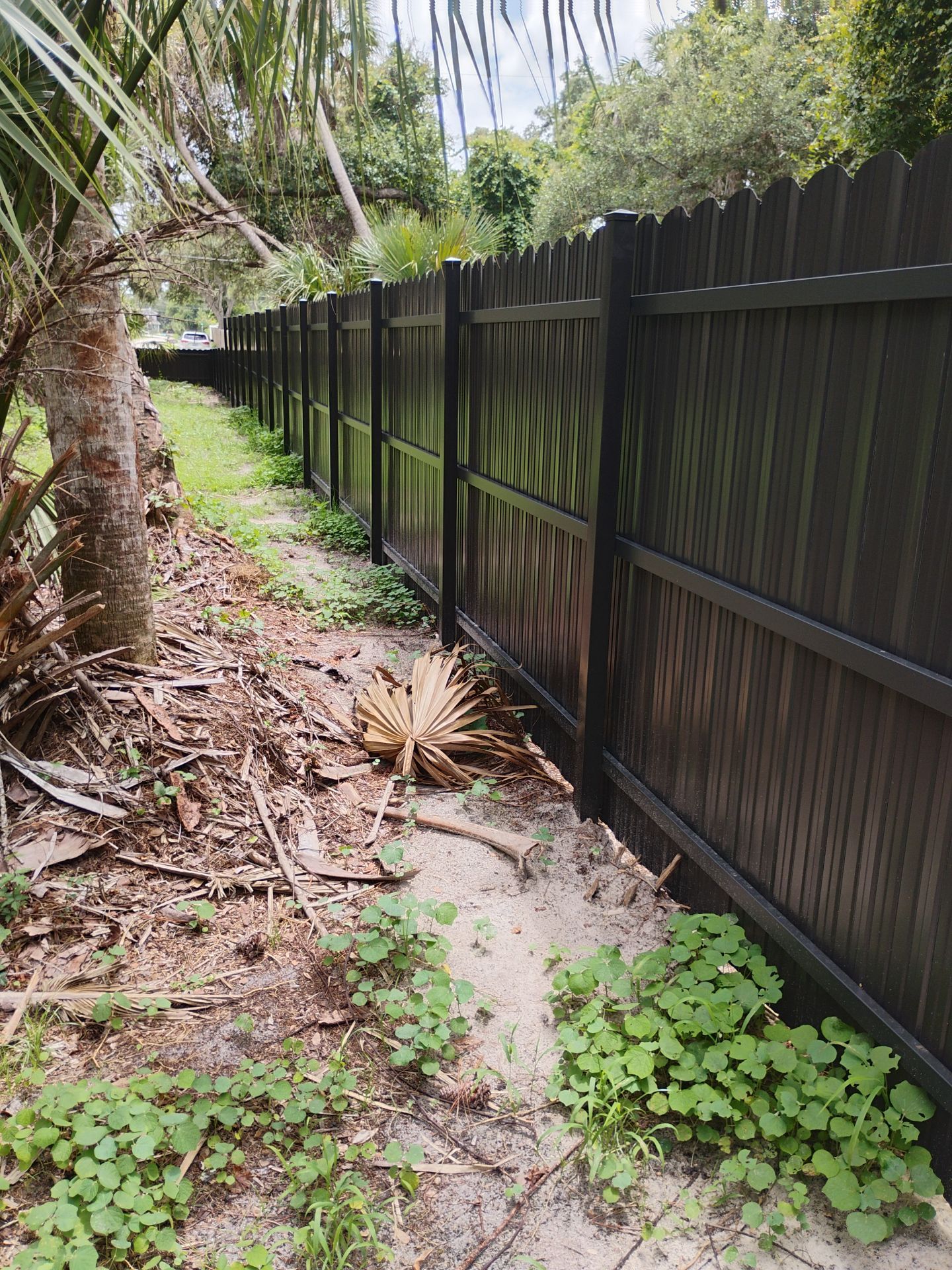 Bronze Scalloped Metal Privacy Fence Installation in North Port by True Fence LLC