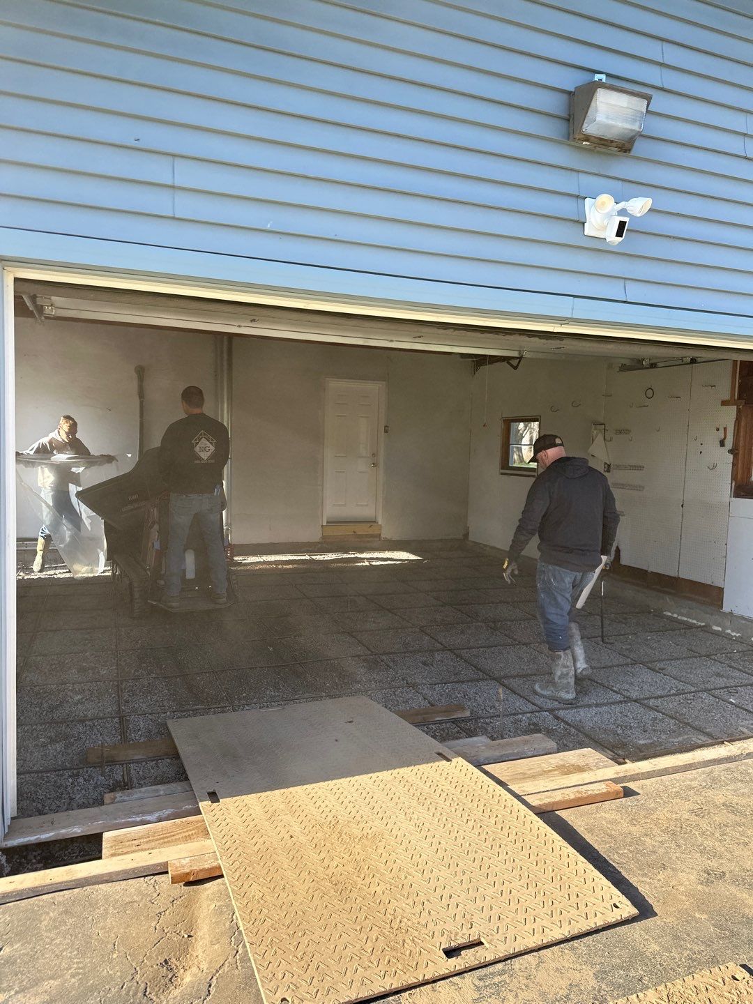 Concrete garage floor replacement by NG Masonry & Construction LLC