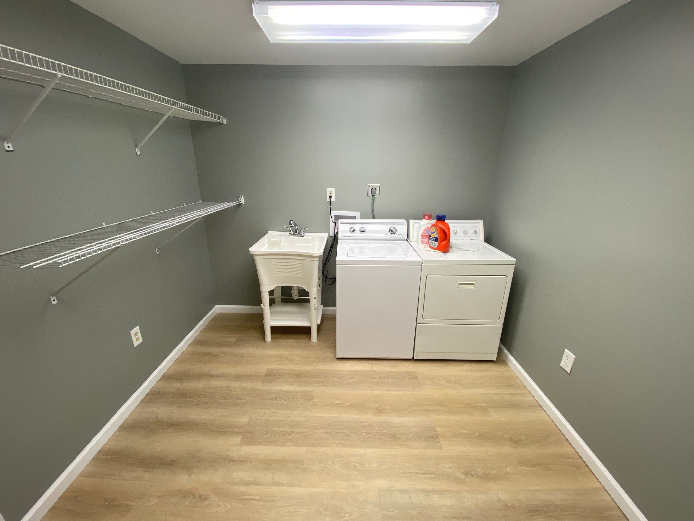 Laundry Room Redmodel using Lifeproof Luxury Vinyl Plank Flooring by The Smet Companies, LLC