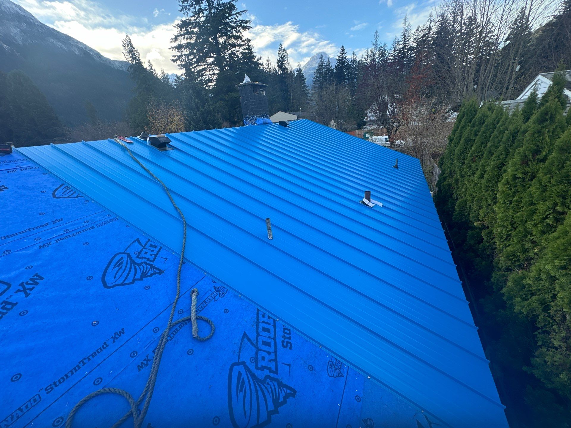 Residential Re-Roof using 12" Prolok metal  by Top Notch Roofing Inc