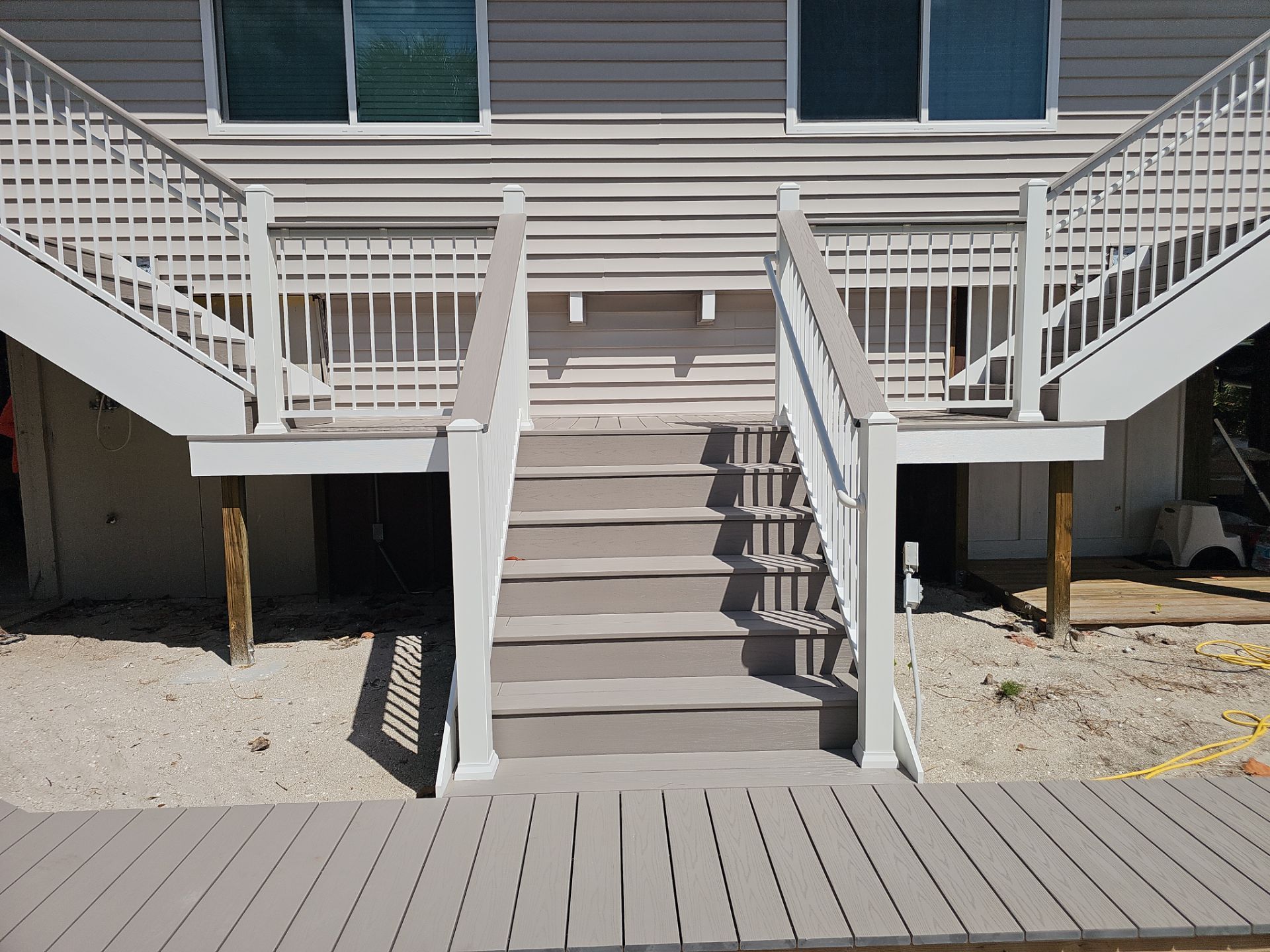 Elevated Composite Deck and Symmetrical Staircase Replacement in Englewood by Smirnov Construction Inc
