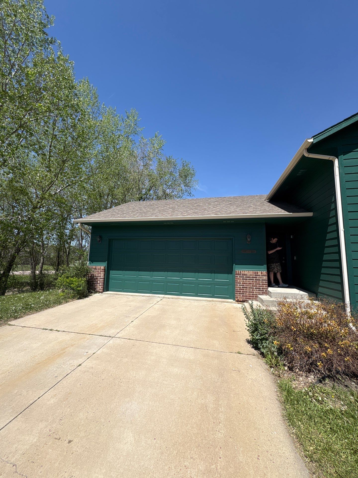 Full Exterior Residential Painting and Siding Refresh in Sioux Falls by Select Painting, Coatings & Garage Cabinets