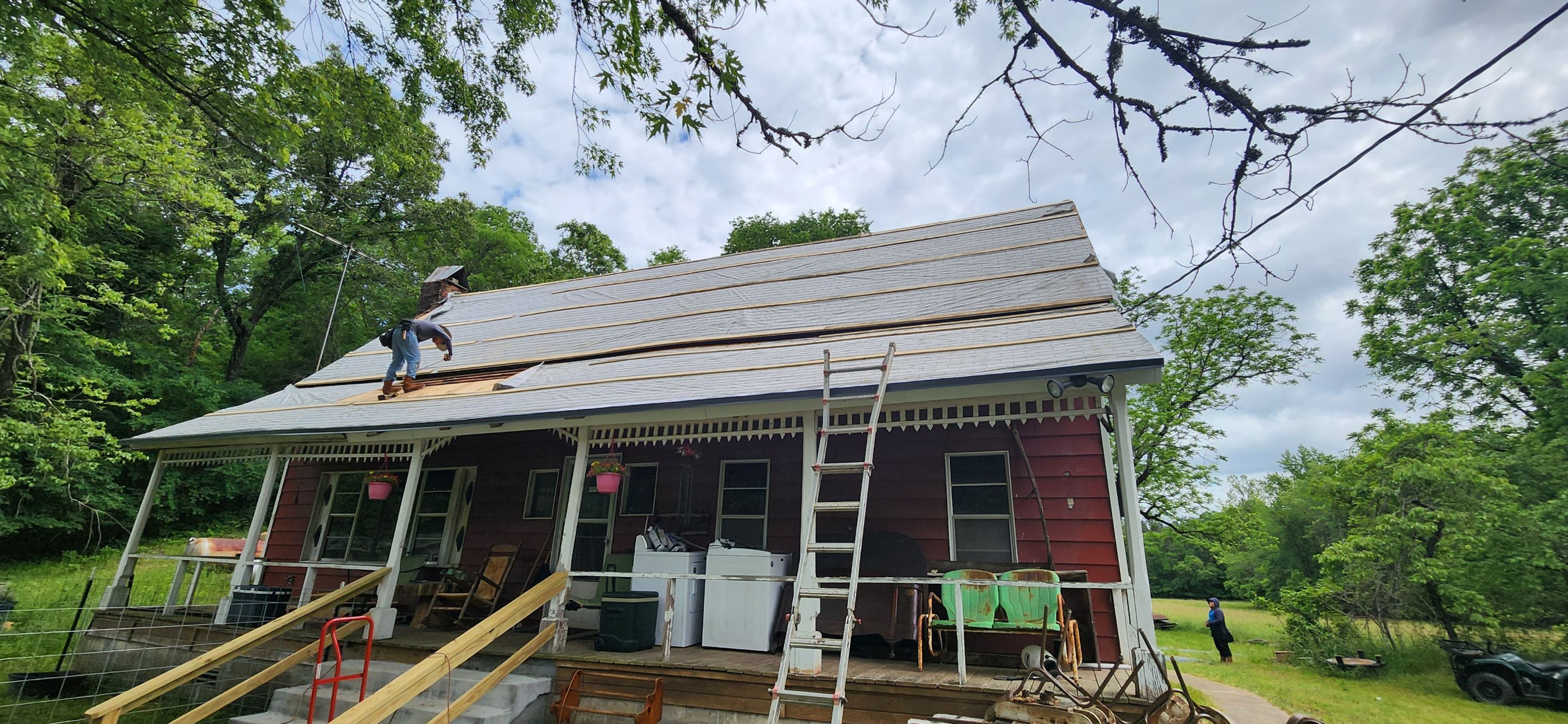 Residential Roofing Installation using 26 Gauge Colored Panels by Hostetler Roofing