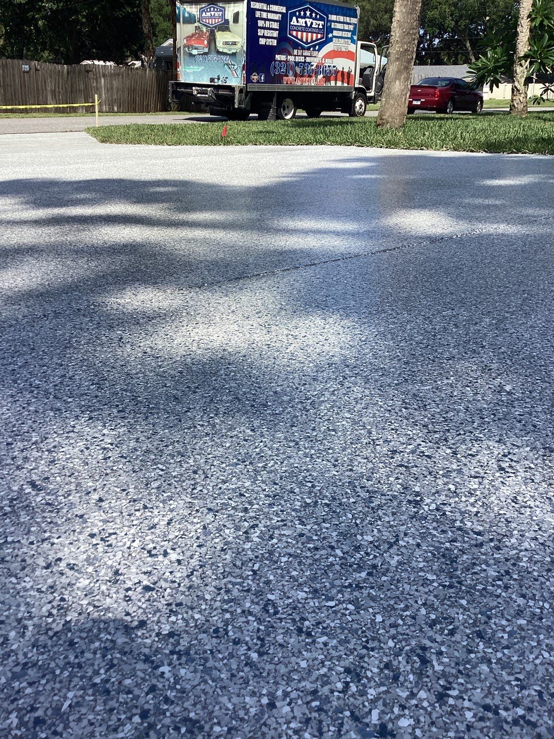 Driveway and Garage using Tidal Wave by Amvet concrete coatings llc