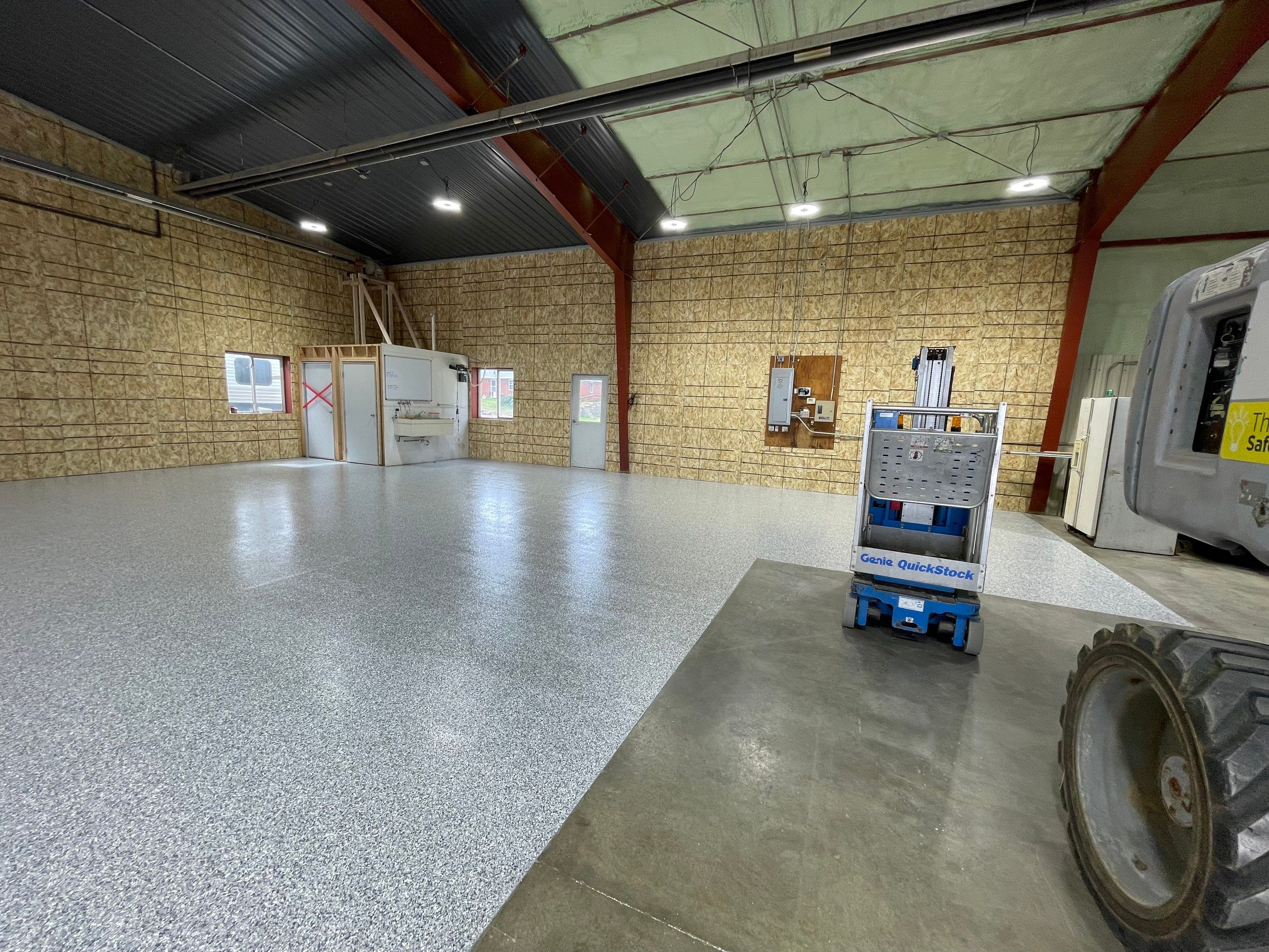 Custom Polyurea Shop Floor with Basketball Court Lines in Rock Valley by Select Painting, Coatings & Garage Cabinets