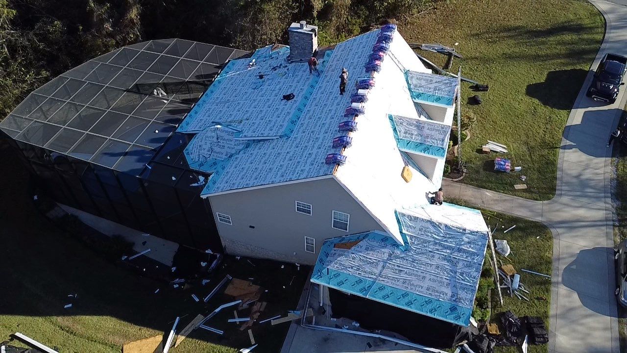 Roof and Gutter System Replacement with Stone Chimney Rebuild by Undersun Roofing 