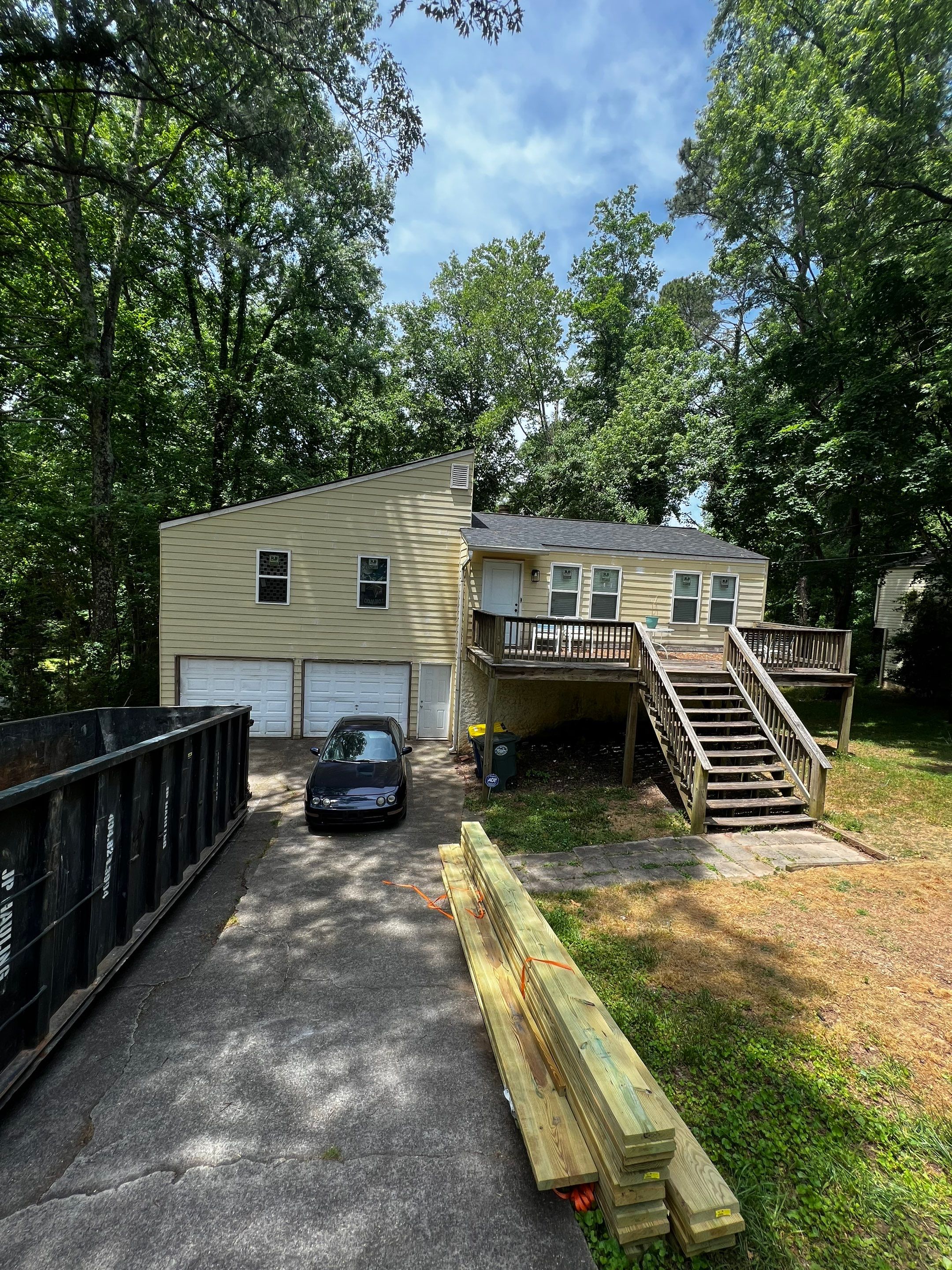 Elevated Wood Deck and Blue Lap Siding Installation in Kennesaw by Swift Home Renovations