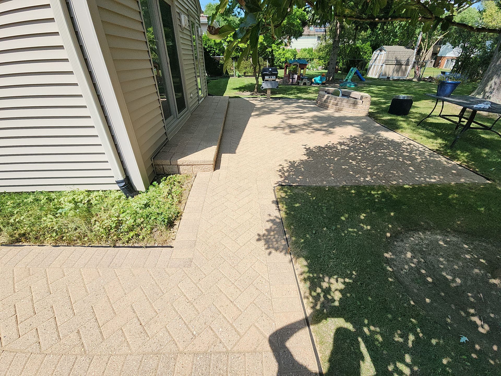 Arlington Heights Brick paver repair, cleaning and sealing by Northern Power Washing LLC.