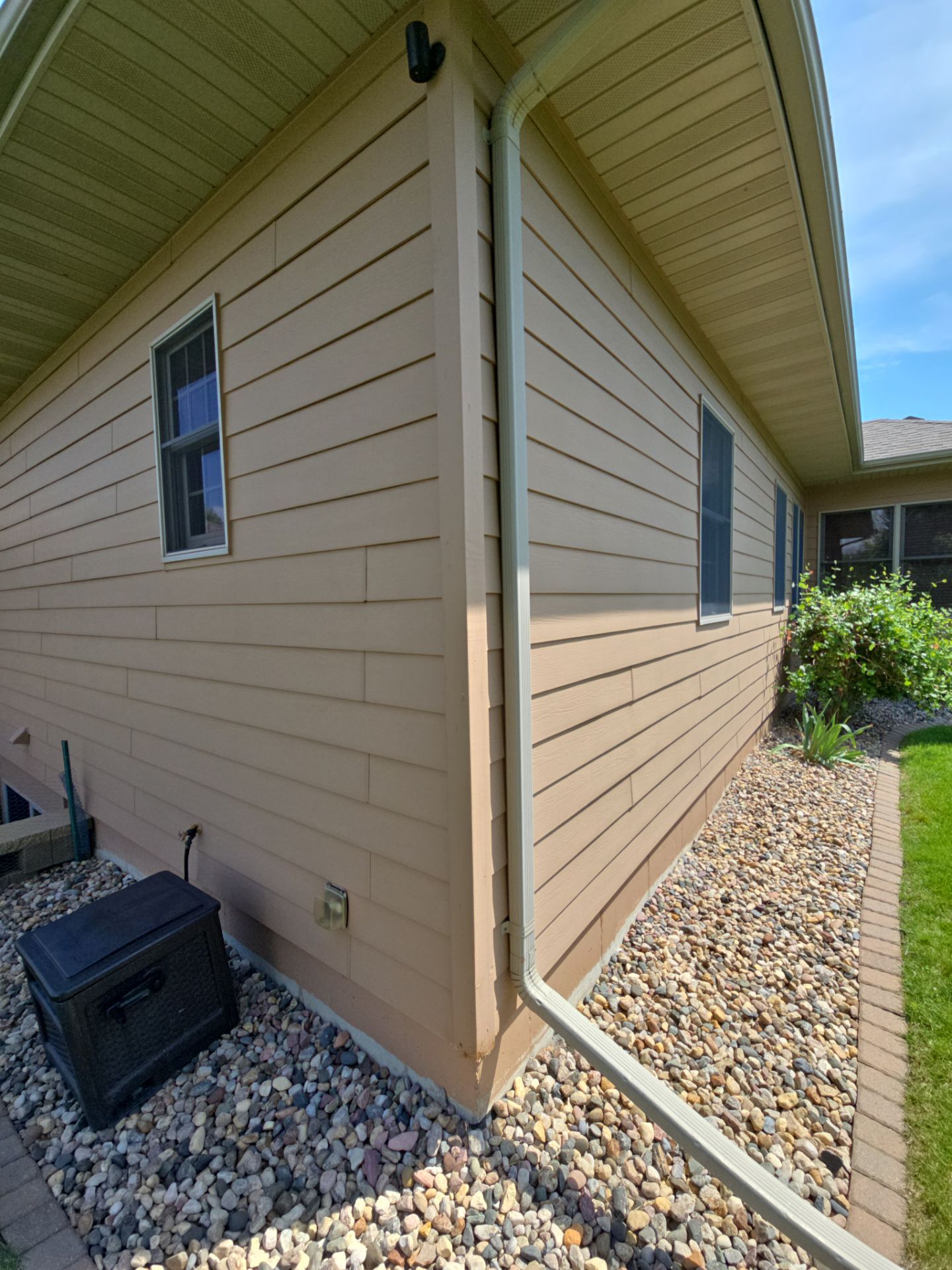 Sioux Falls Residential Exterior Door and Siding Refresh by Select Painting, Coatings & Garage Cabinets